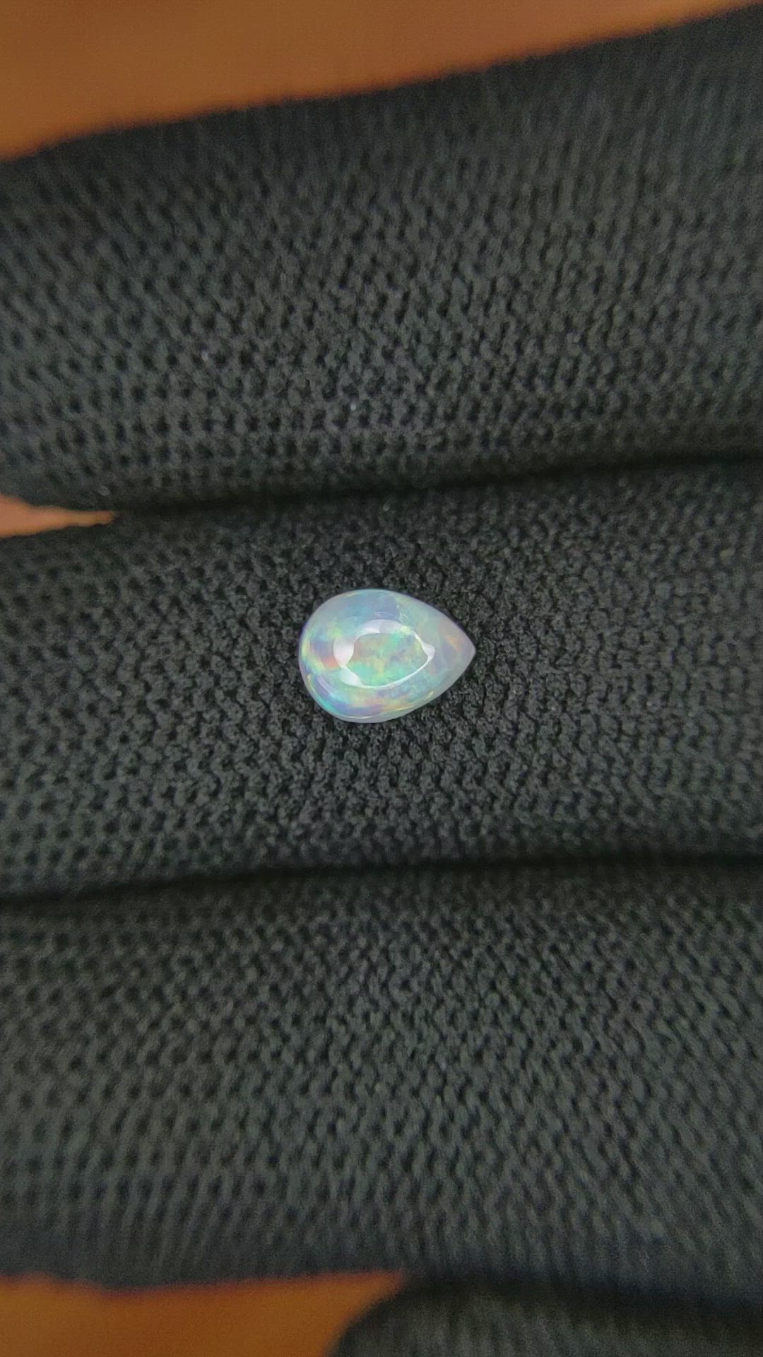 0.68 Ct. Cabochon White Opal from Australia Size Video