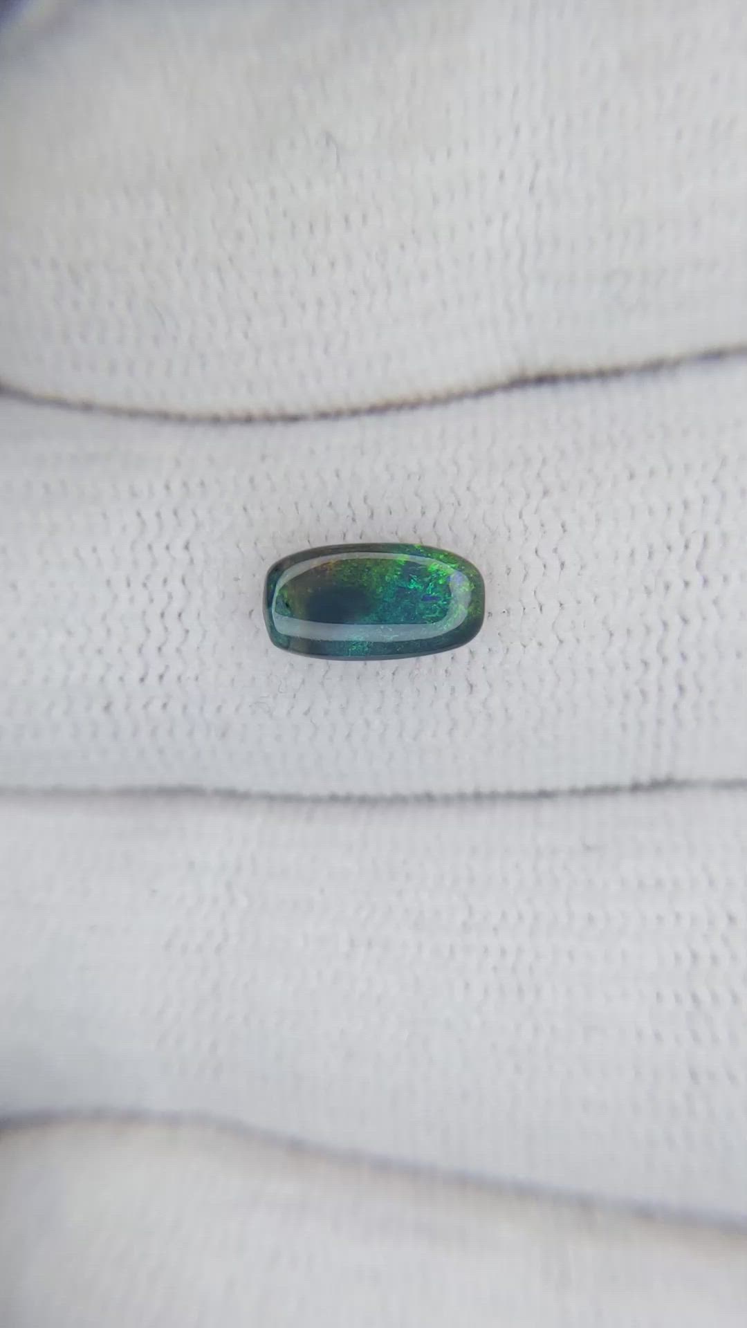 0.69 Ct. Cabochon Black Opal from Australia Size Video
