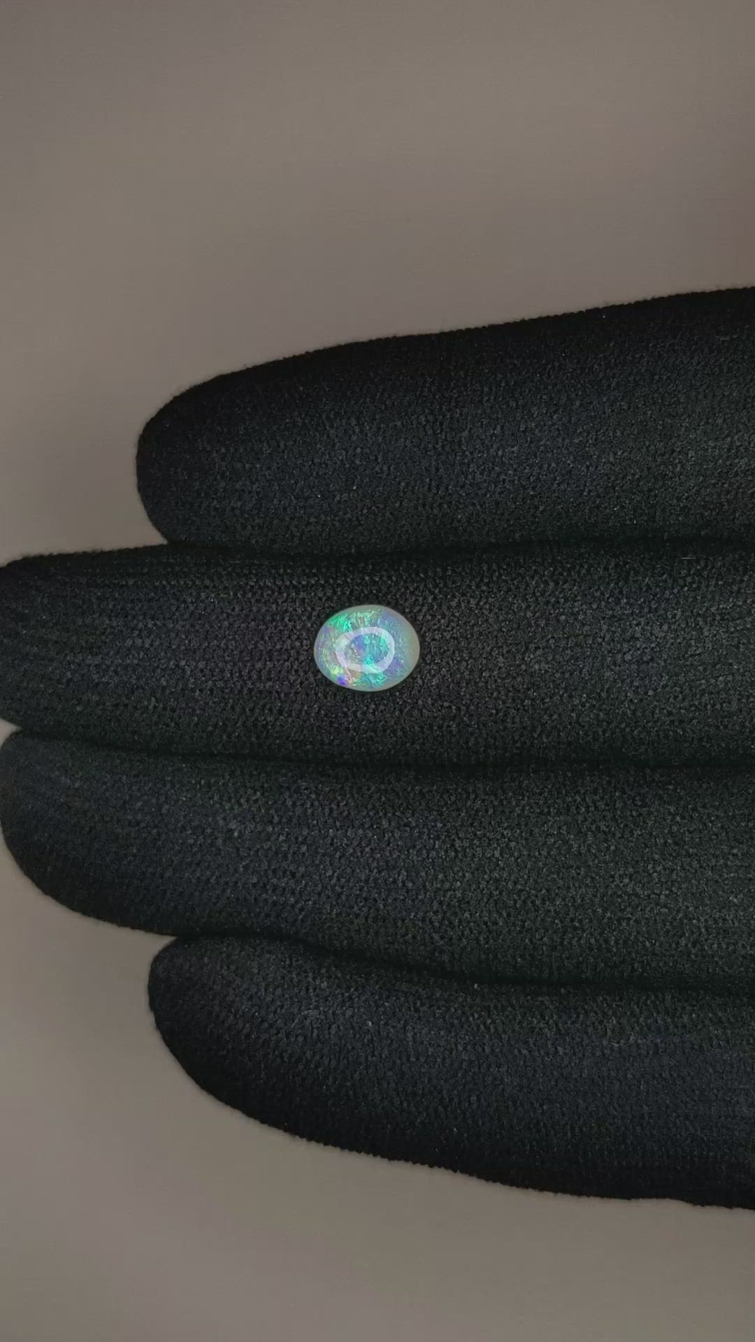 0.74 Ct. Cabochon Black Opal from Australia Size Video