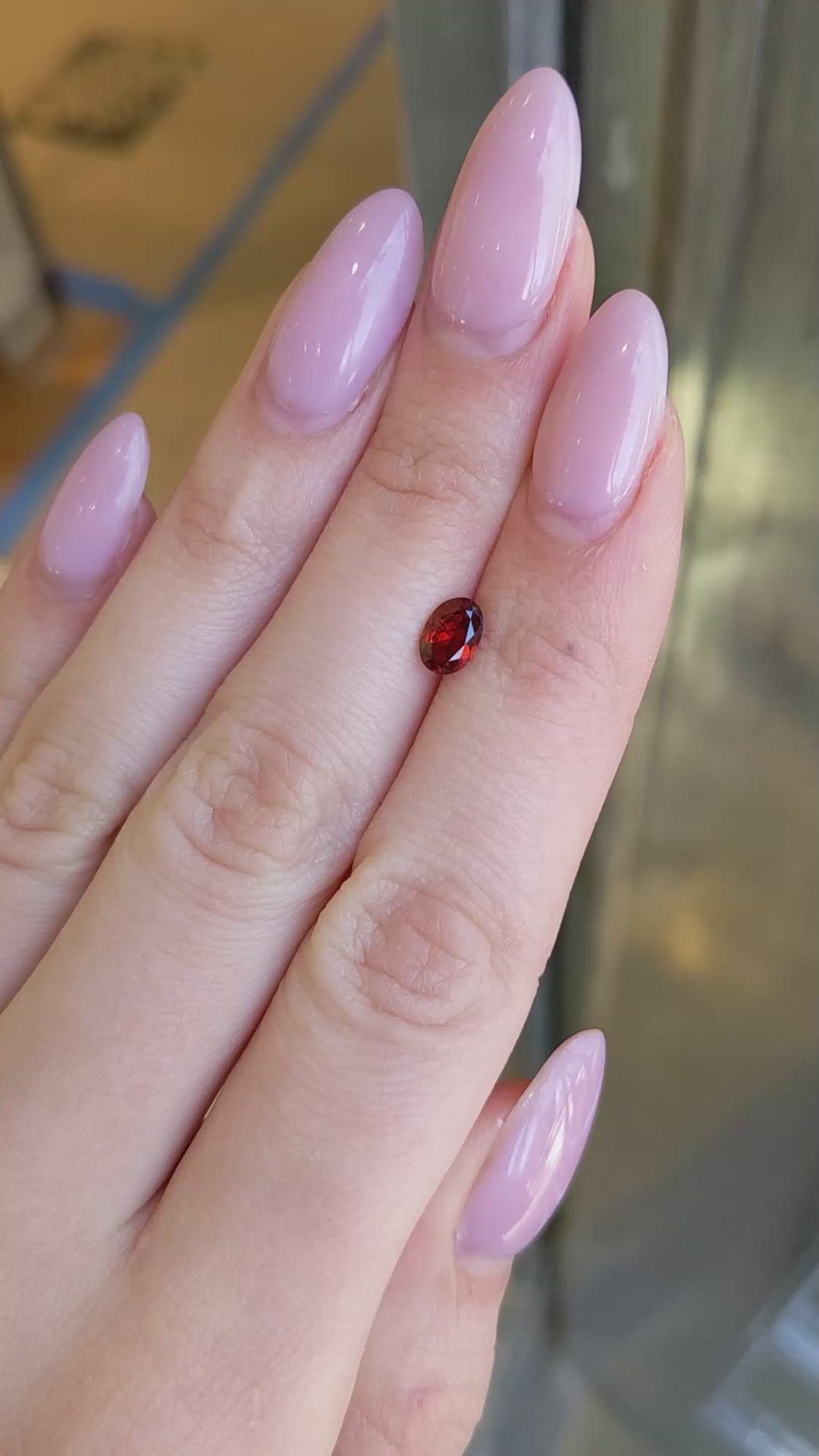 0.74 Ct. Reddish Orange Garnet from Montana Size Video