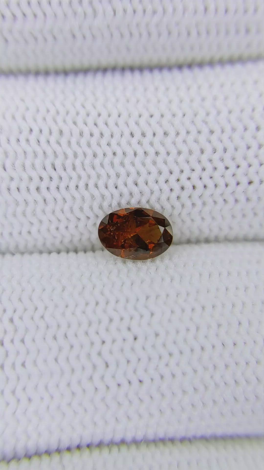 0.74 Ct. Reddish Orange Garnet from Montana Size Video