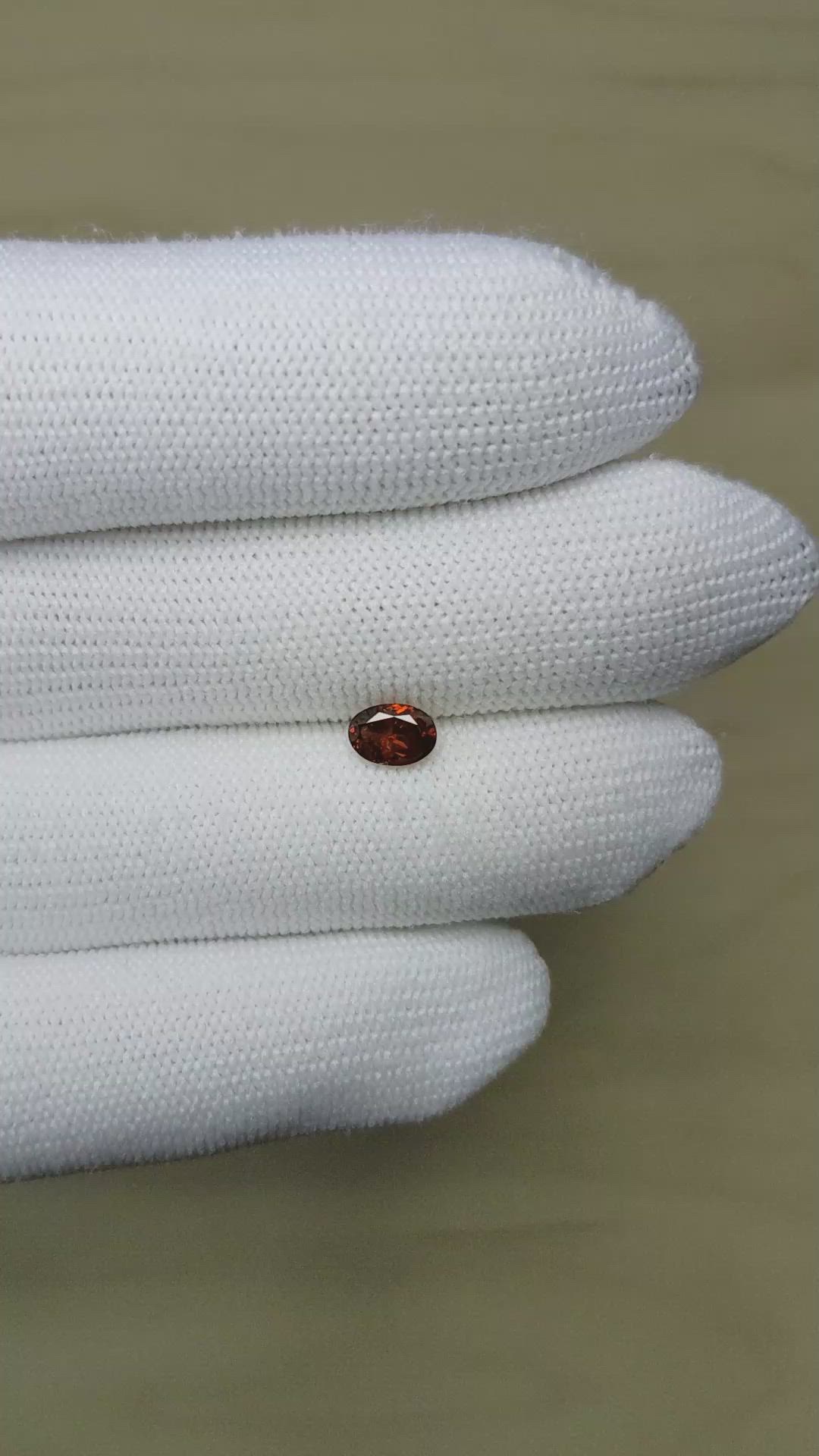 0.74 Ct. Reddish Orange Garnet from Montana Size Video