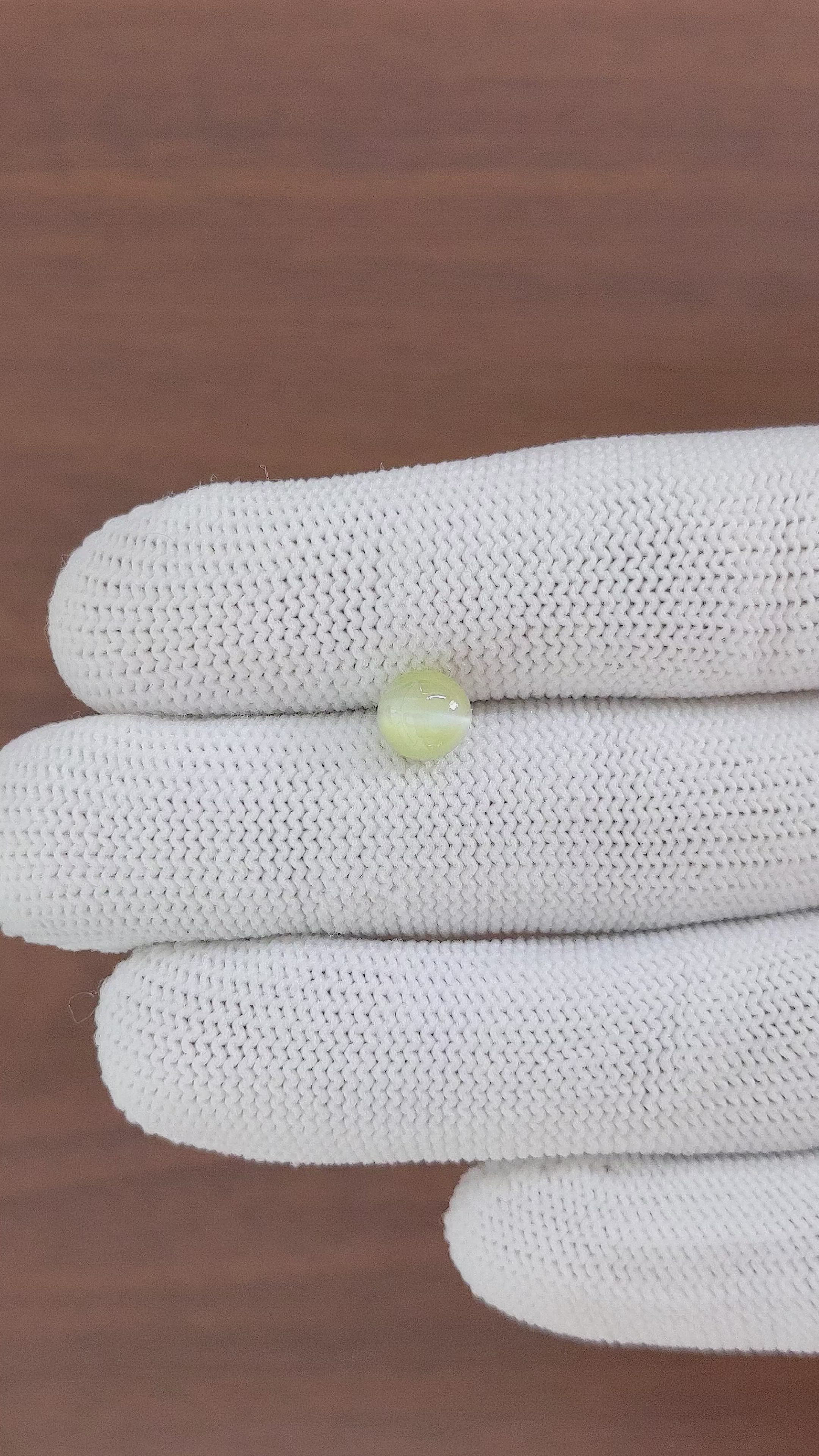 2.11 Ct. Greenish Yellow Cabochon Chrysoberyl from Madagascar Size Video