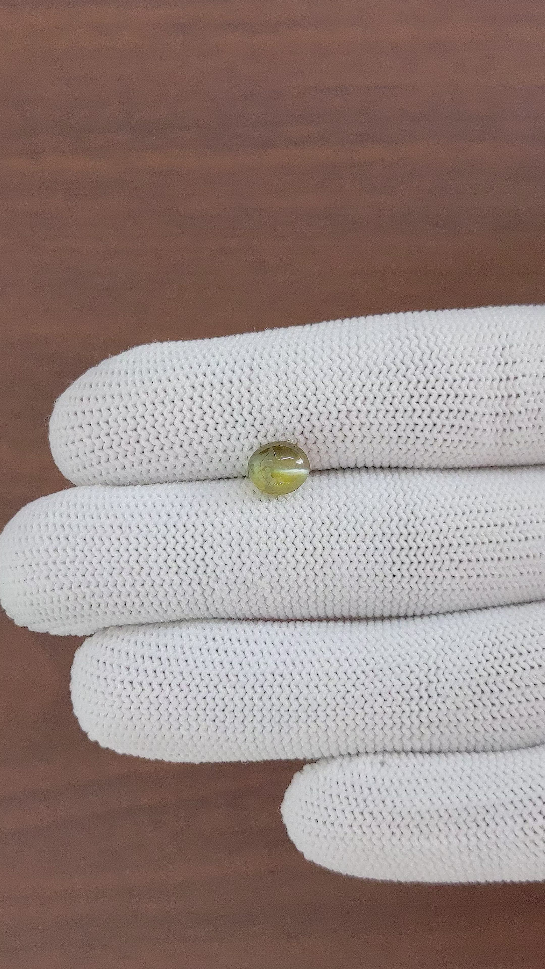 2.32 Ct. Brownish Green Cabochon Chrysoberyl from Madagascar Size Video