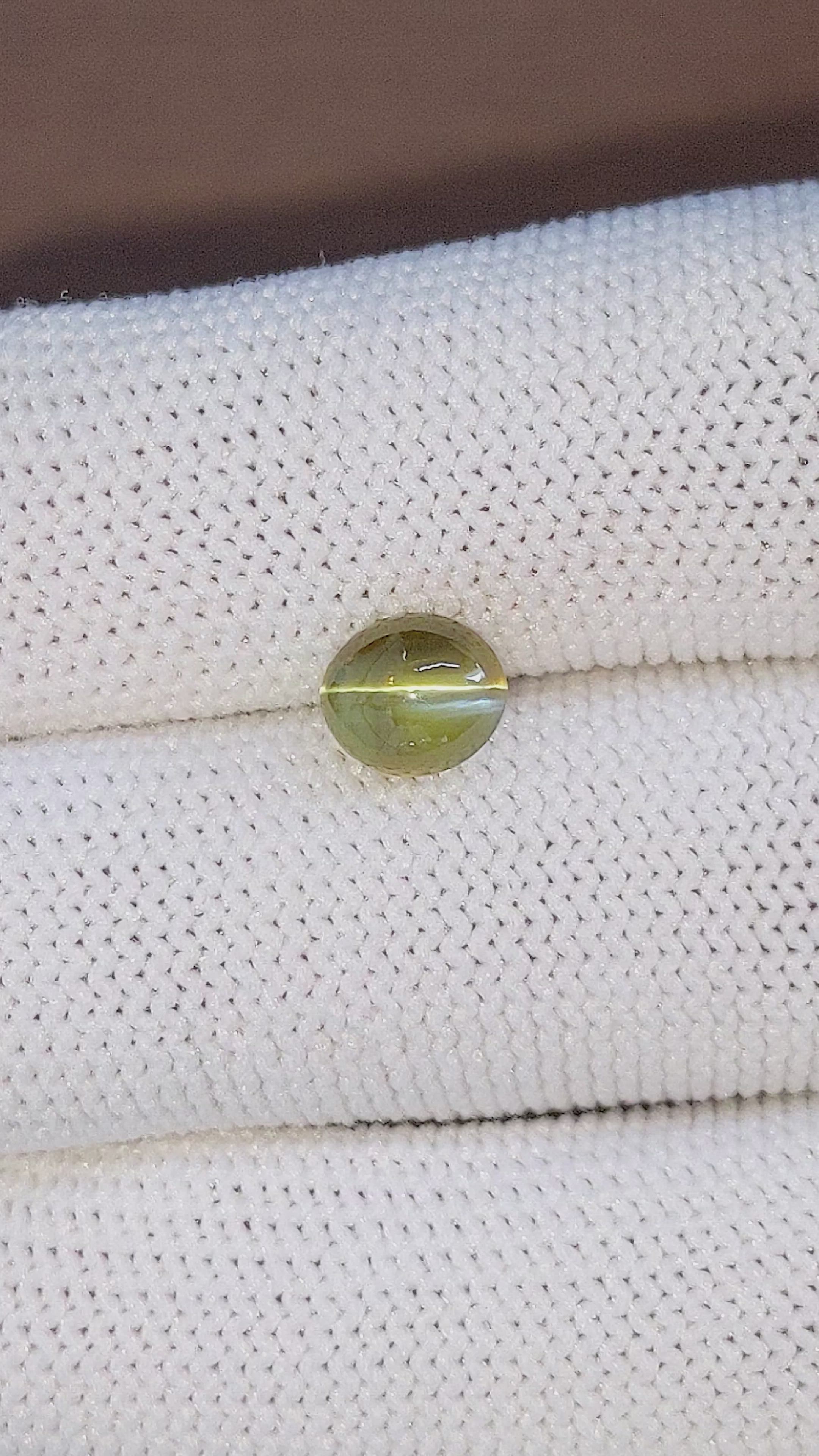 2.32 Ct. Brownish Green Cabochon Chrysoberyl from Madagascar Size Video