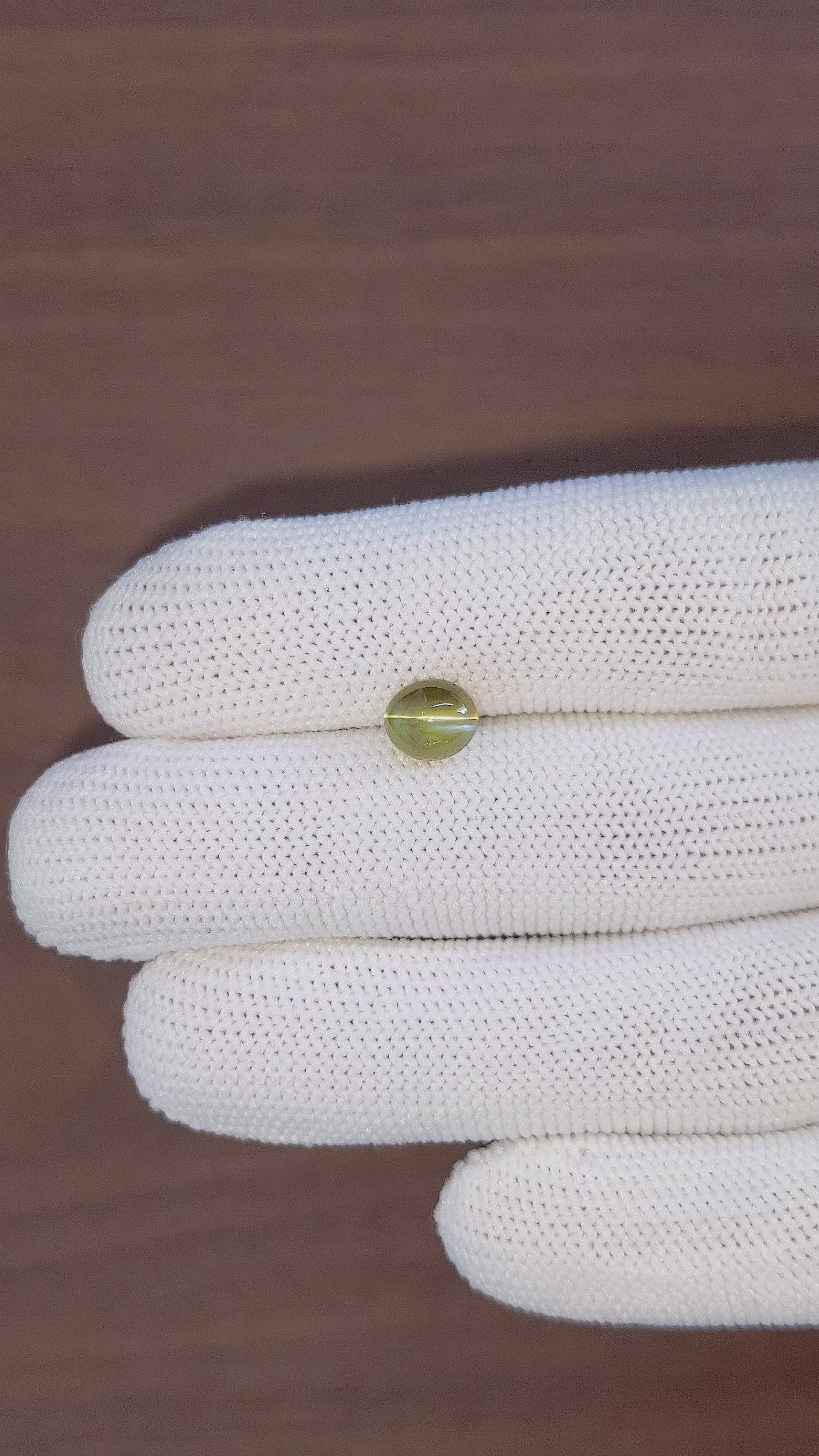 2.32 Ct. Brownish Green Cabochon Chrysoberyl from Madagascar Size Video