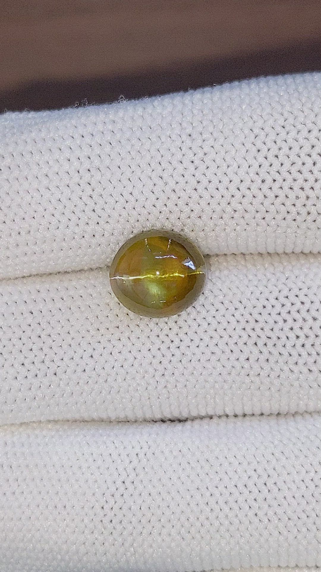 6.77 Ct. Brown Cabochon Chrysoberyl from Ceylon (Sri Lanka) Size Video