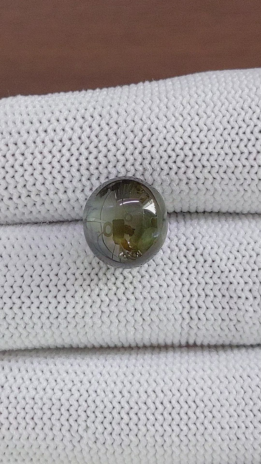12.67 Ct. Brownish Green Cabochon Chrysoberyl from Ceylon (Sri Lanka) Size Video
