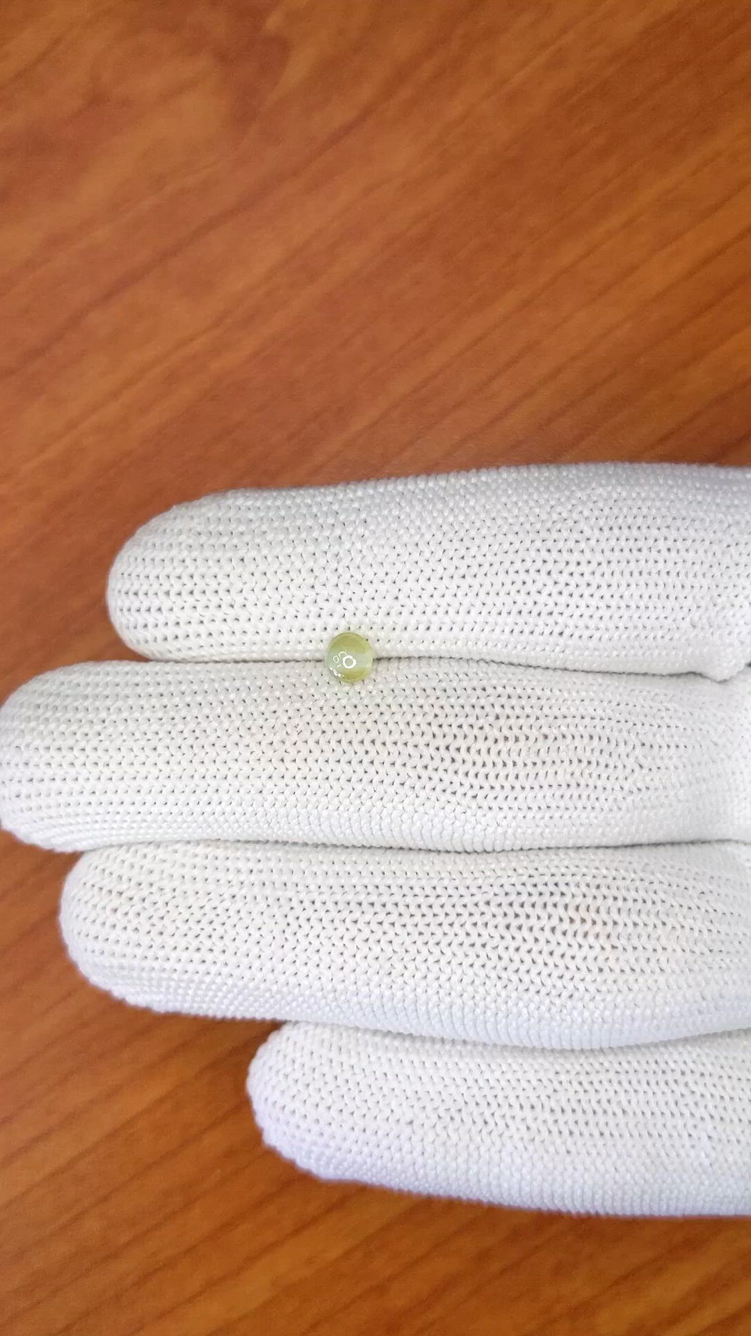 0.57 Ct. Greenish Yellow Cabochon Chrysoberyl from Ceylon (Sri Lanka) Size Video