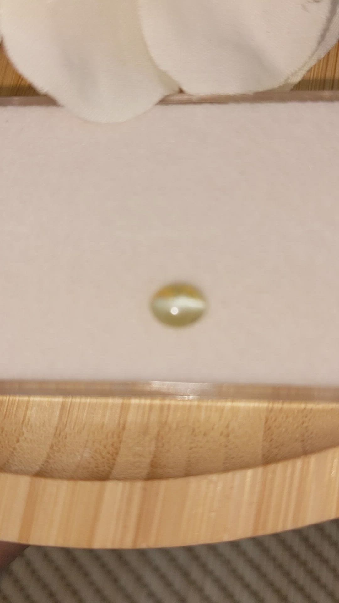 0.75 Ct. Greenish Yellow Cabochon Chrysoberyl from Ceylon (Sri Lanka) Size Video