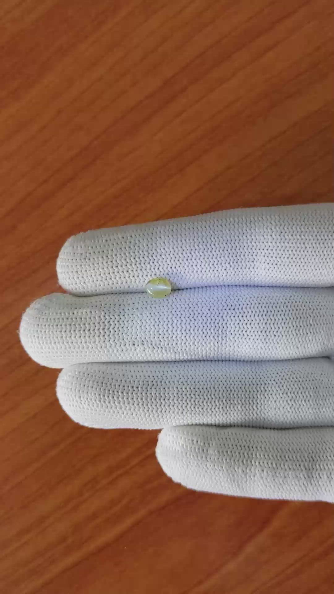 0.75 Ct. Greenish Yellow Cabochon Chrysoberyl from Ceylon (Sri Lanka) Size Video