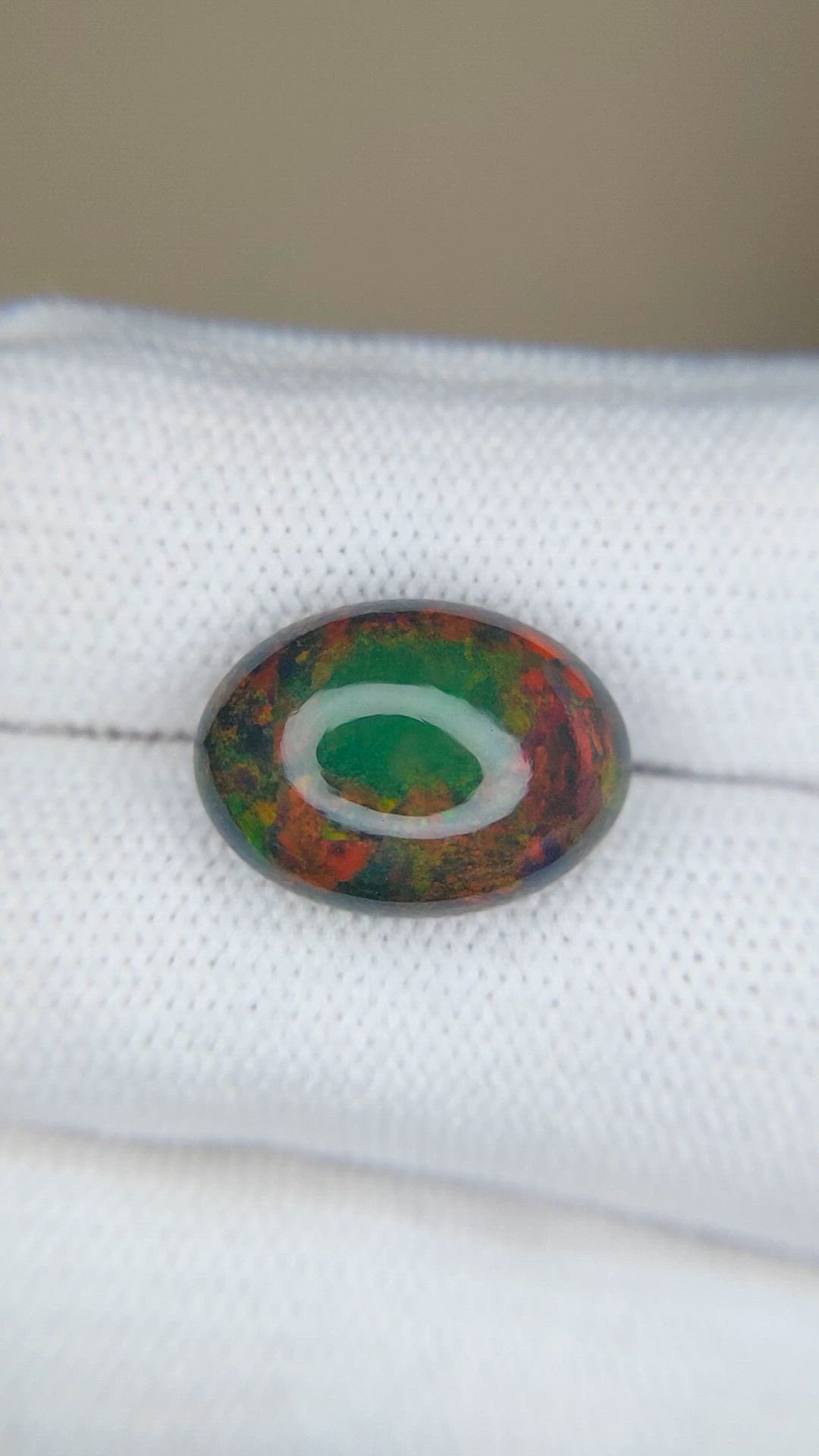 4.77 Ct. Multi Color Cabochon Black Opal from Ethiopia Size Video