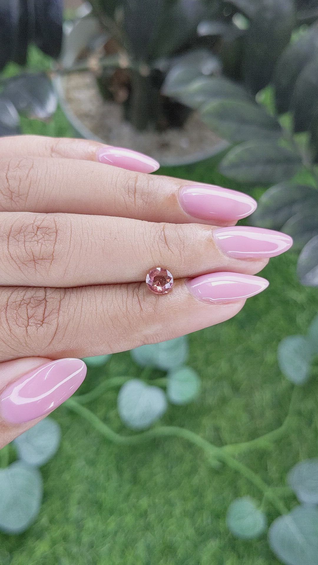 0.73 Ct. Orangish Pink Malaya Garnet from Tanzania Size Video