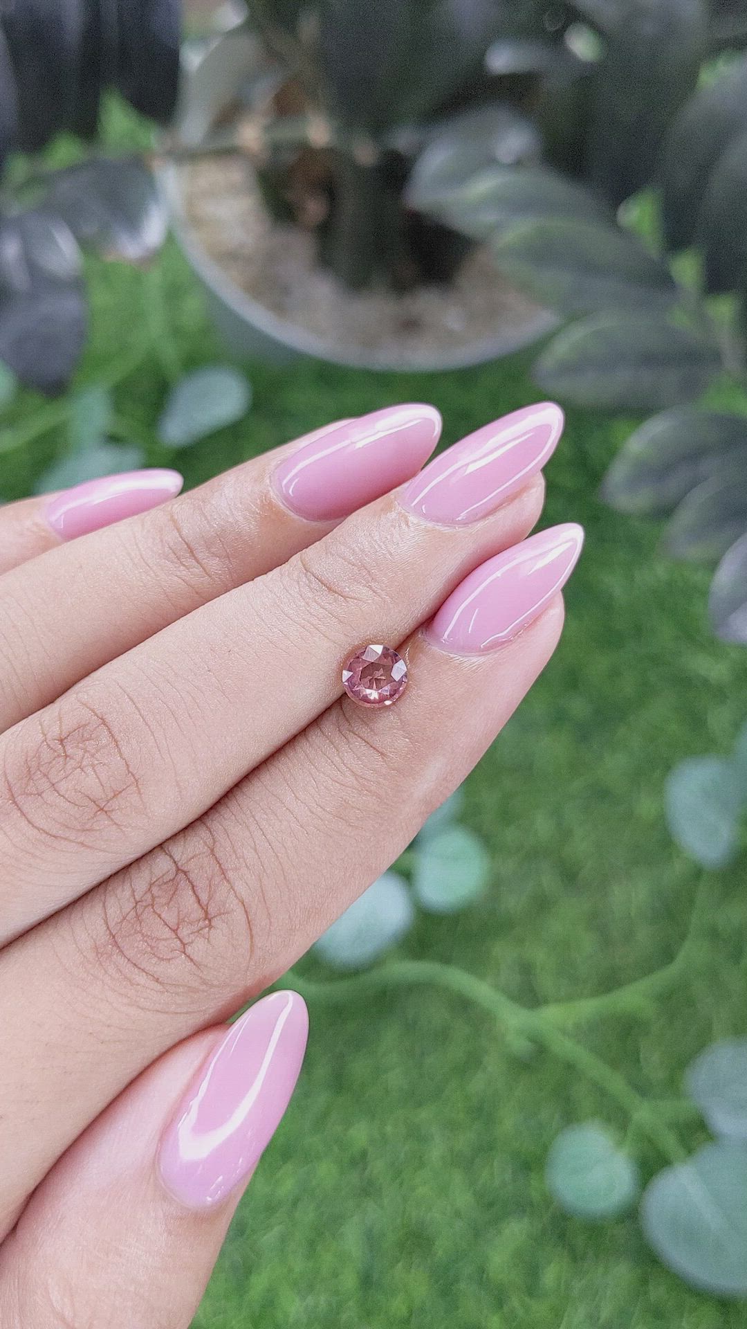 0.73 Ct. Orangish Pink Malaya Garnet from Tanzania Size Video