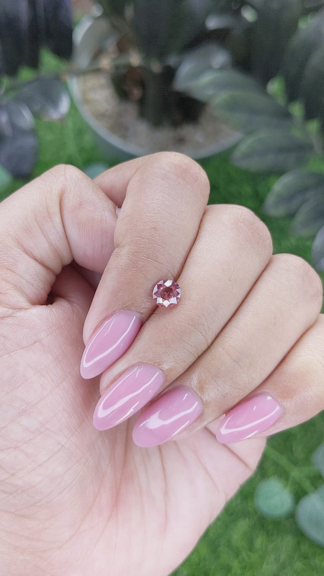 0.73 Ct. Orangish Pink Malaya Garnet from Tanzania Size Video