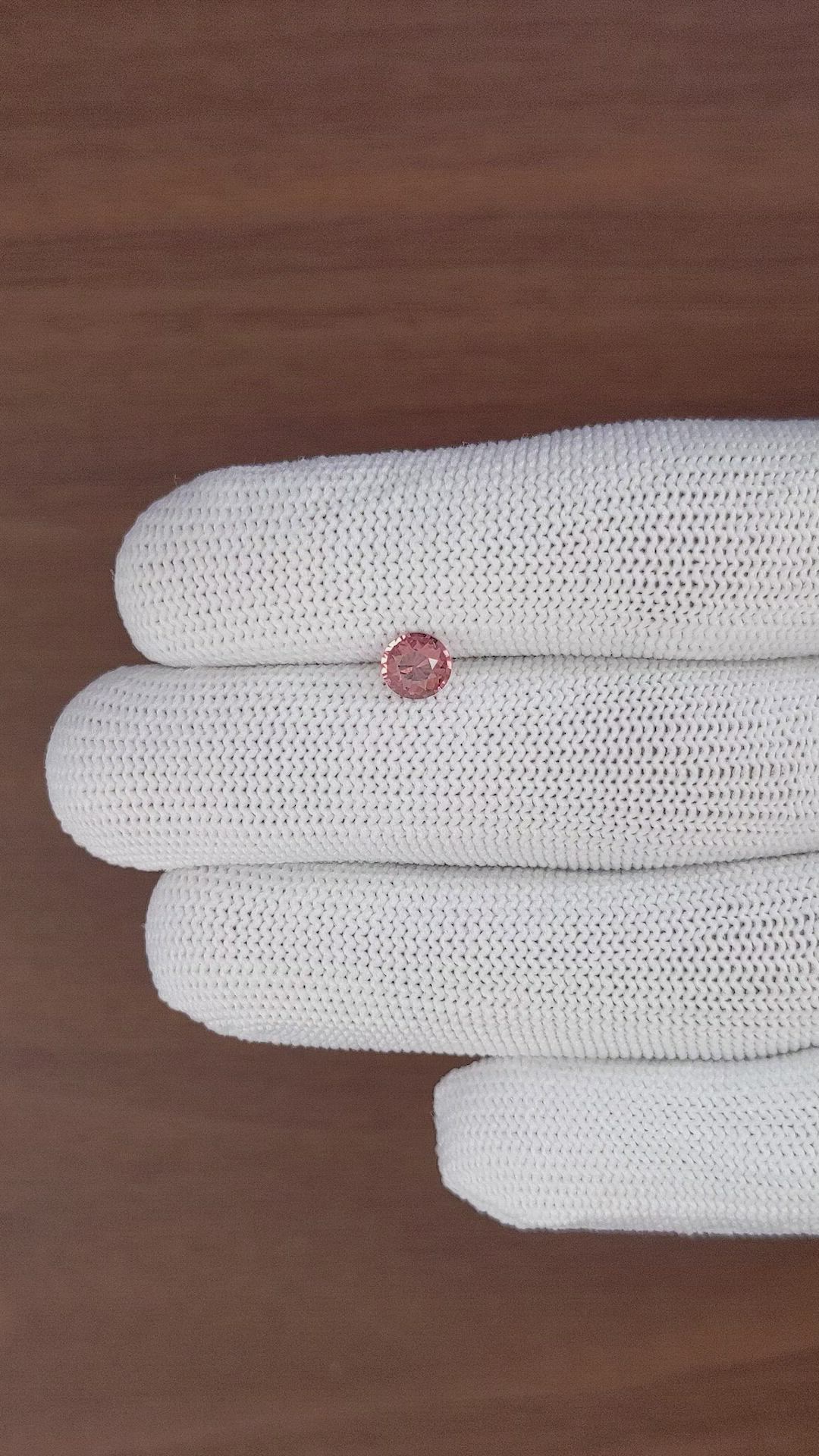 0.73 Ct. Orangish Pink Malaya Garnet from Tanzania Size Video