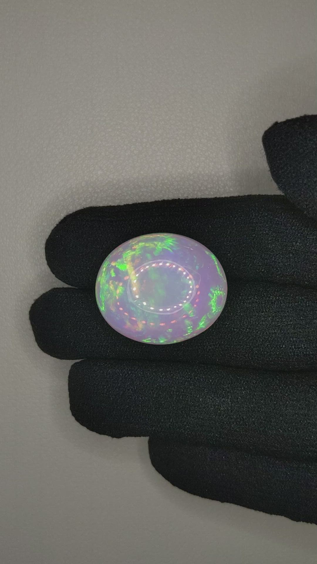 24.81 Ct. Multi Color Cabochon White Opal from Ethiopia Size Video