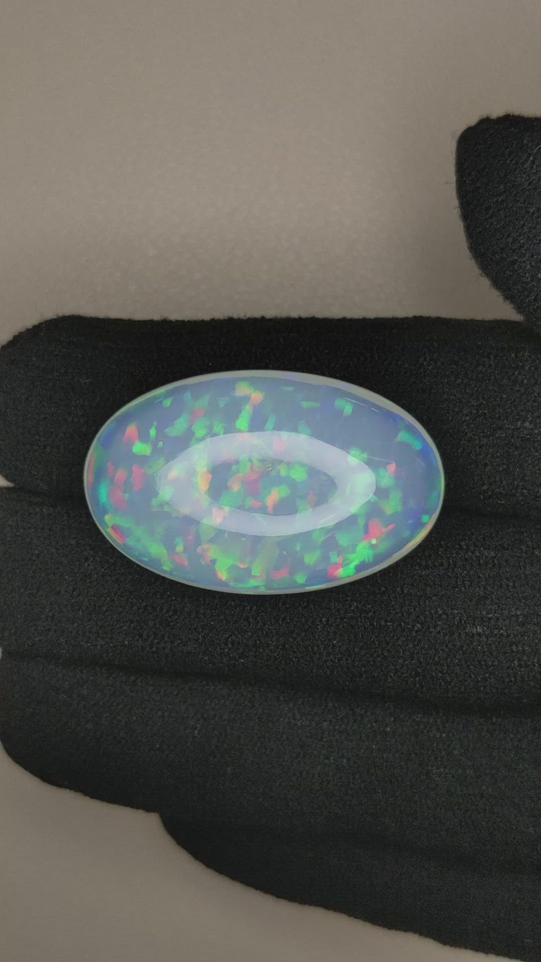 25.85 Ct. Multi Color Cabochon White Opal from Ethiopia Size Video