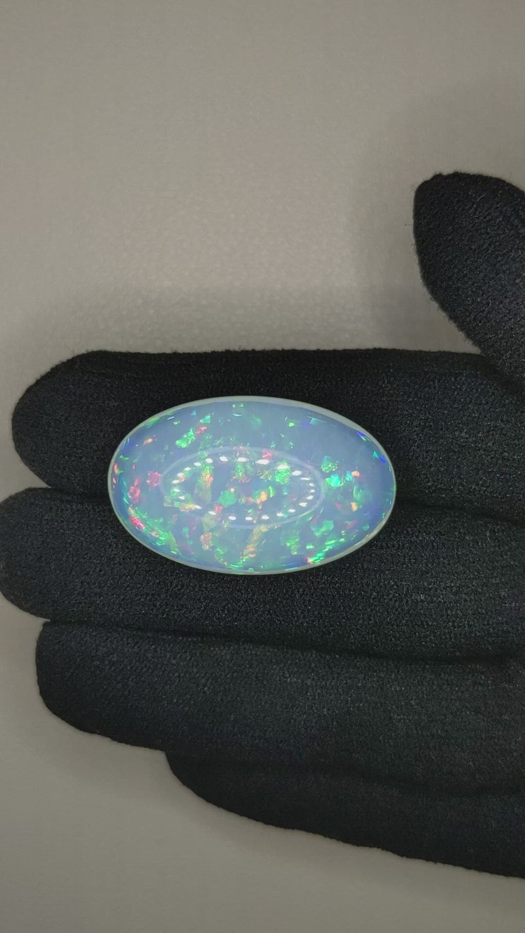 25.85 Ct. Multi Color Cabochon White Opal from Ethiopia Size Video