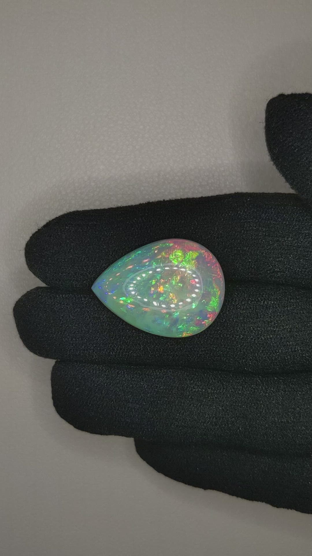 11.12 Ct. Multi Color Cabochon White Opal from Ethiopia Size Video