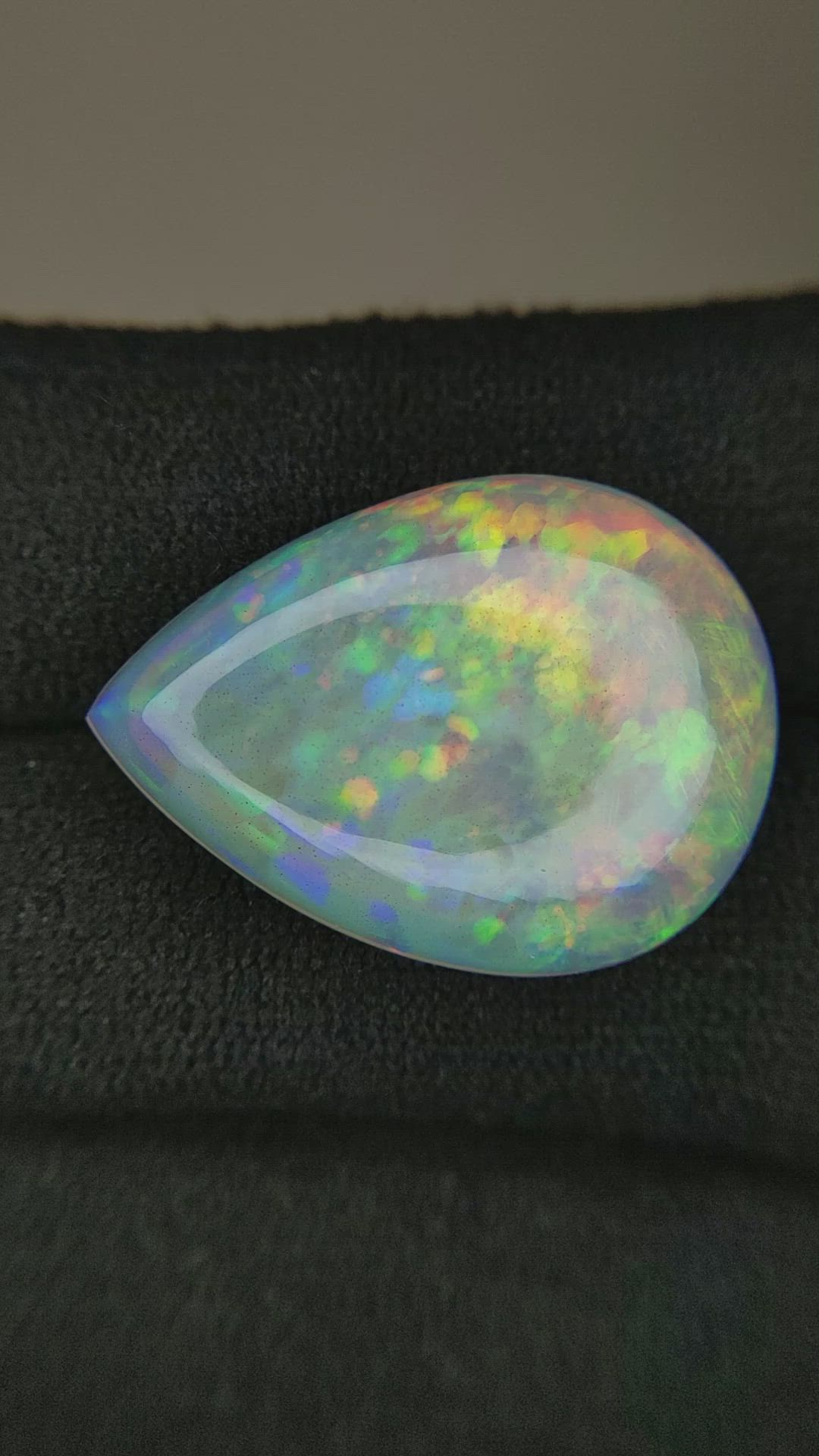11.12 Ct. Multi Color Cabochon White Opal from Ethiopia Size Video