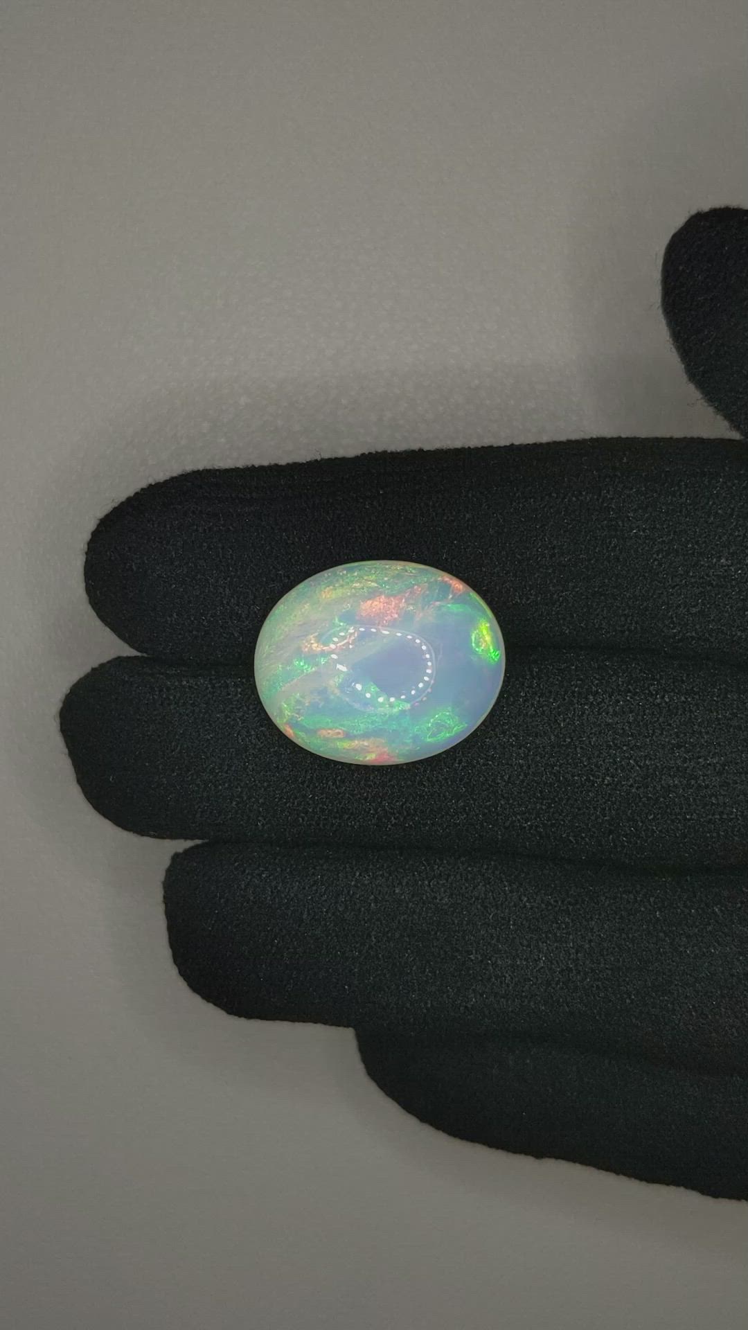 10.05 Ct. Multi Color Cabochon White Opal from Ethiopia Size Video