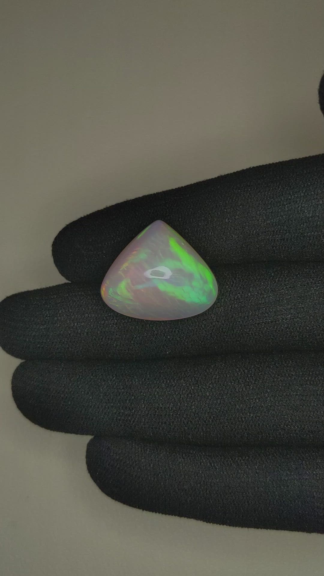 18.51 Ct. Multi Color Cabochon White Opal from Ethiopia Size Video