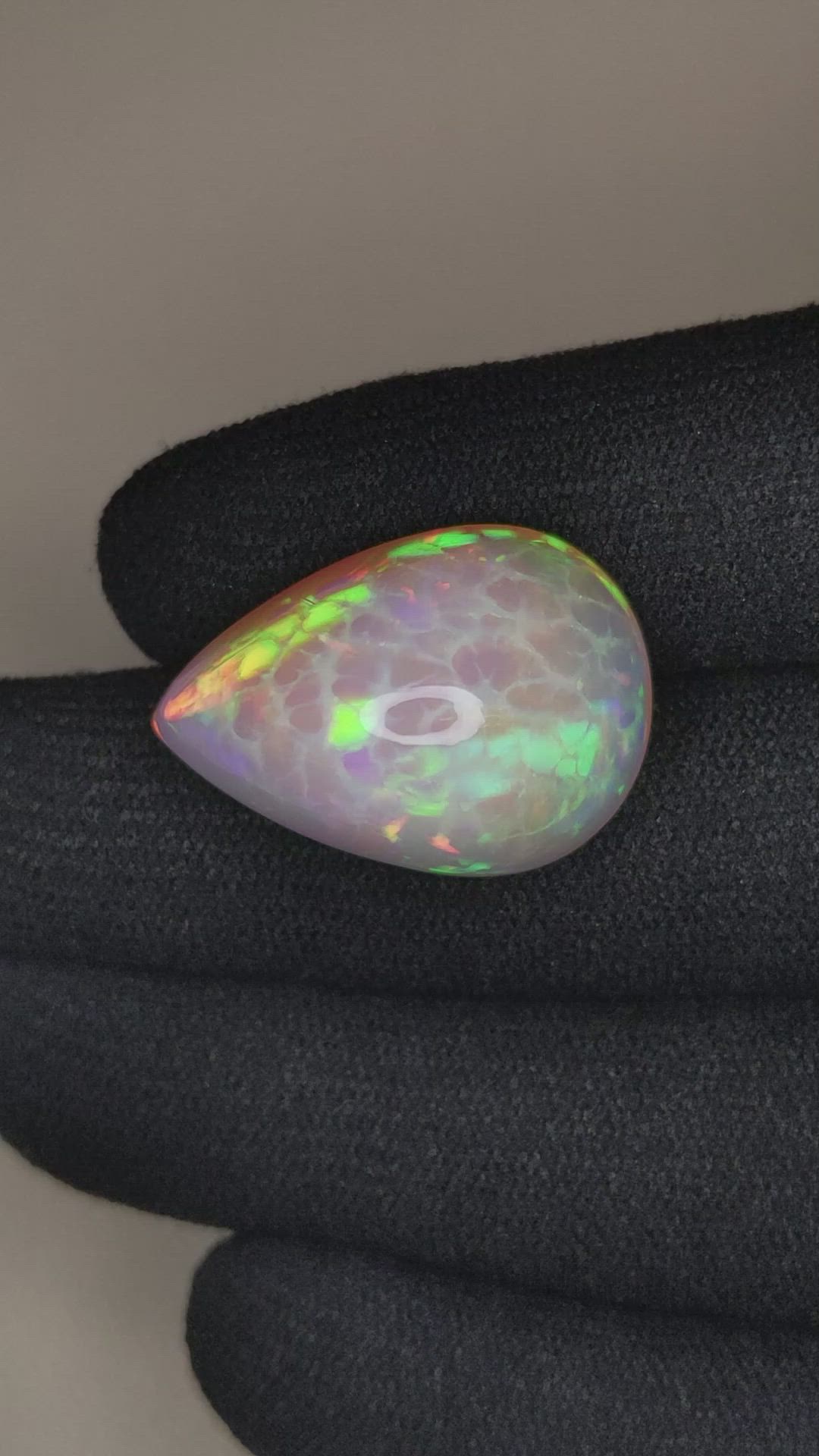22.46 Ct. Multi Color Cabochon White Opal from Ethiopia Size Video