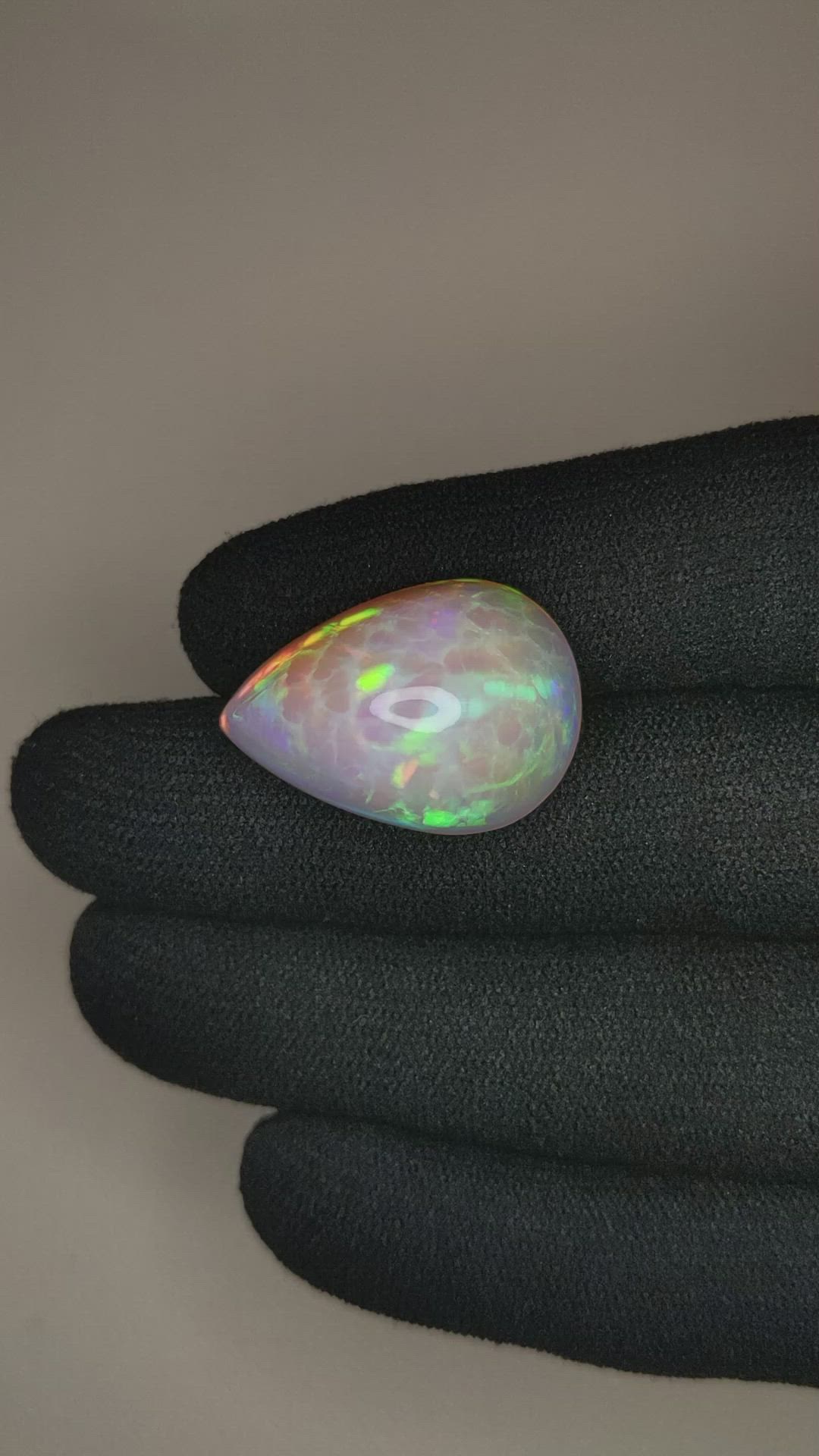 22.46 Ct. Multi Color Cabochon White Opal from Ethiopia Size Video