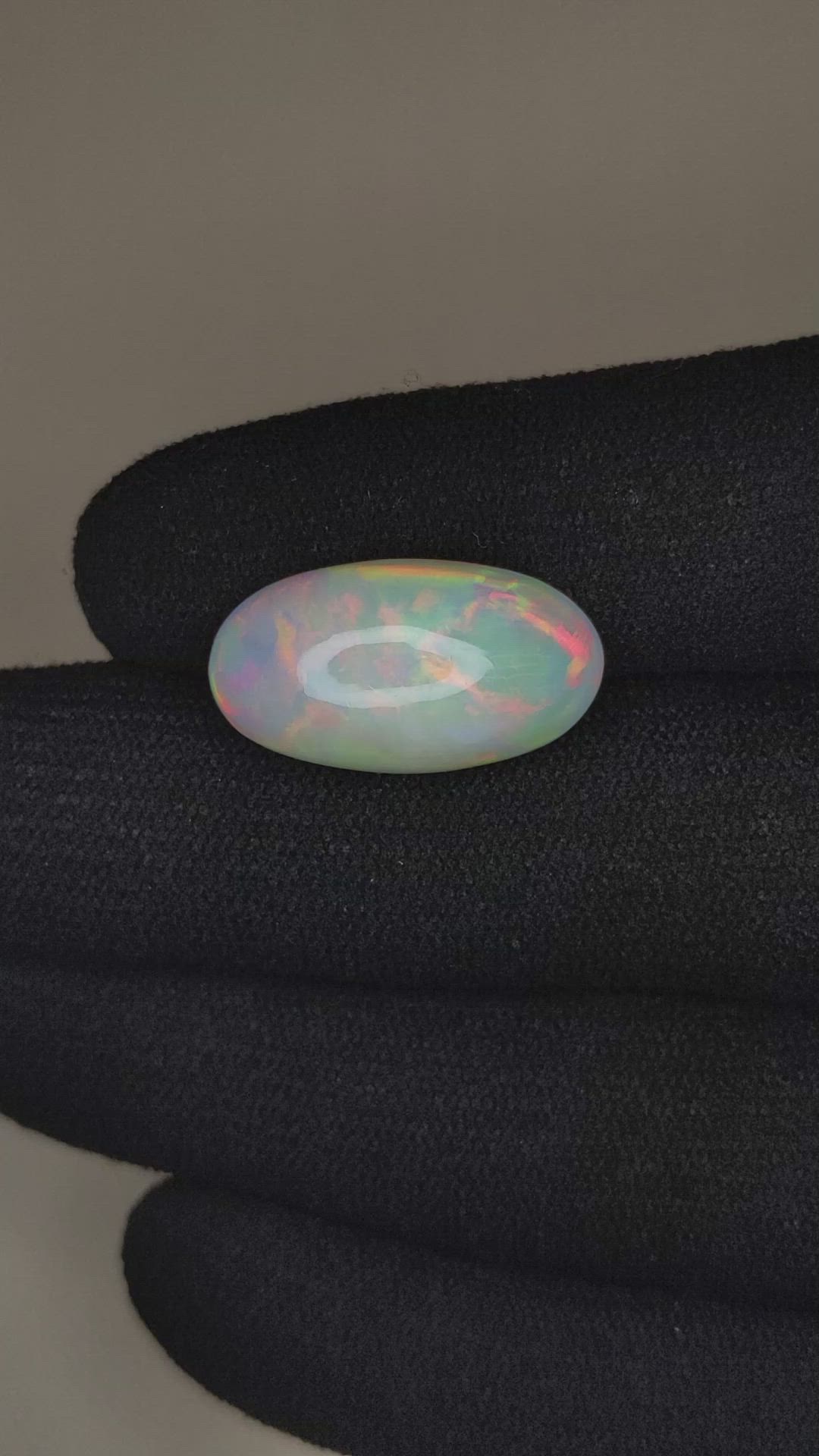 6.77 Ct. Multi Color Cabochon White Opal from Ethiopia Size Video