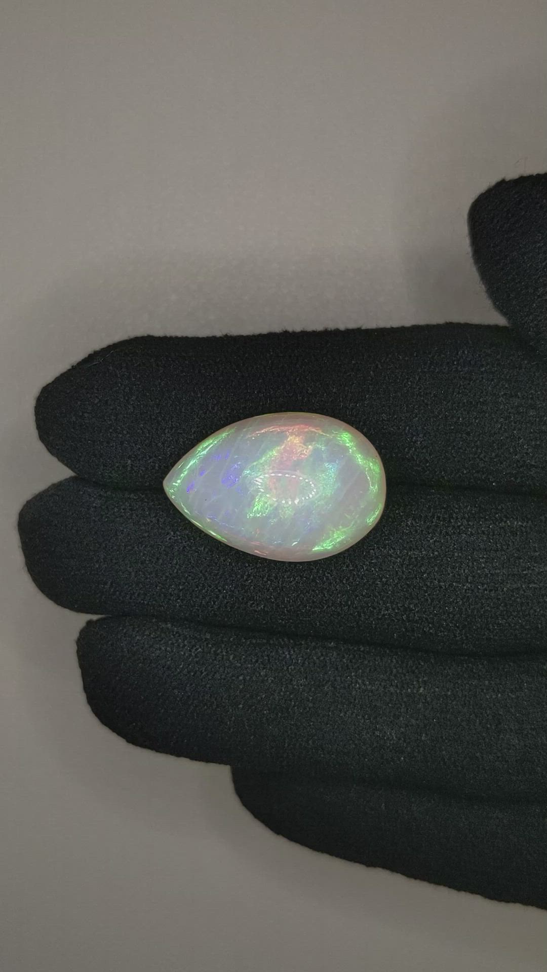 13.78 Ct. Multi Color Cabochon White Opal from Ethiopia Size Video