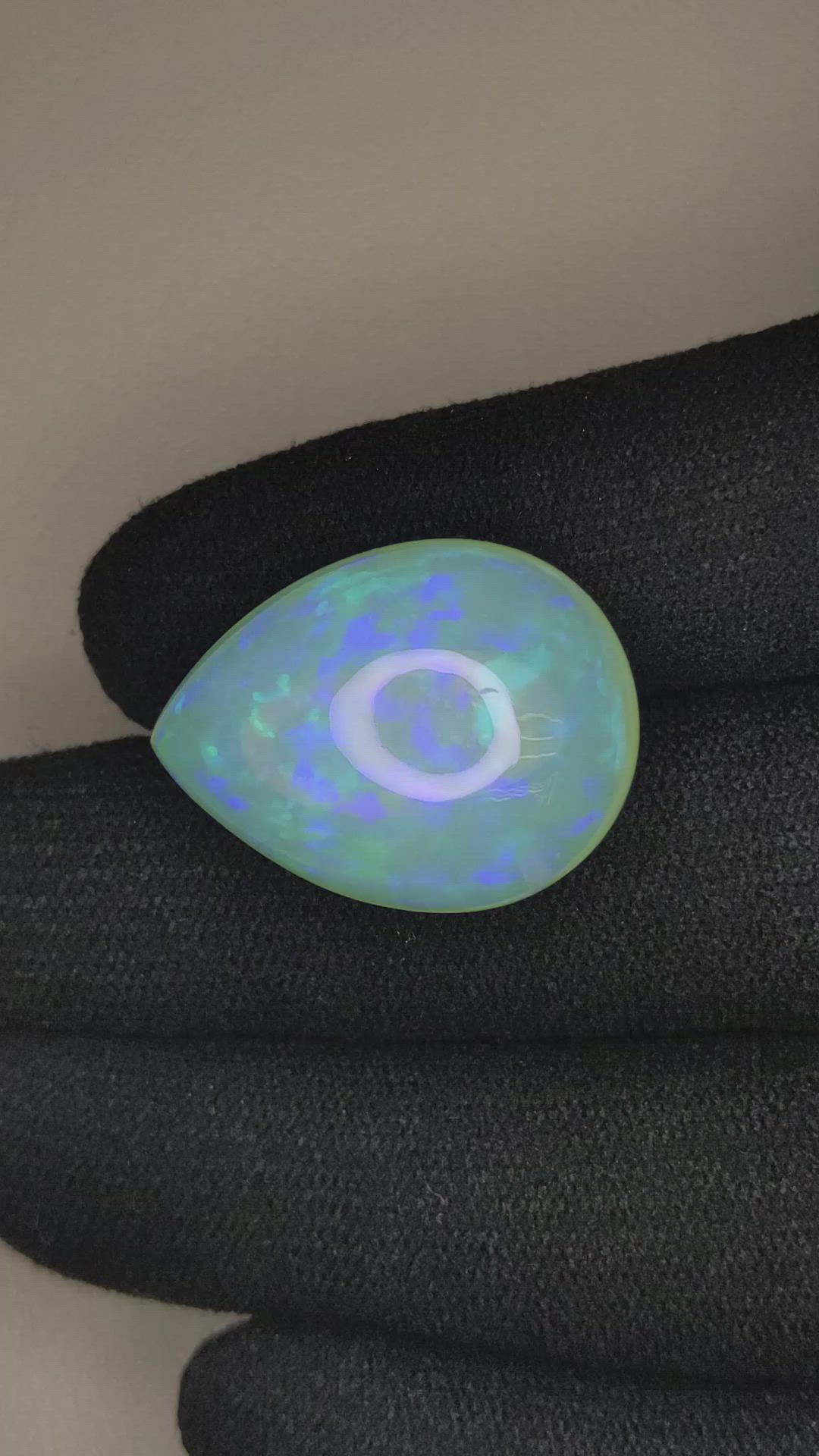 24.73 Ct. Multi Color Cabochon White Opal from Ethiopia Size Video