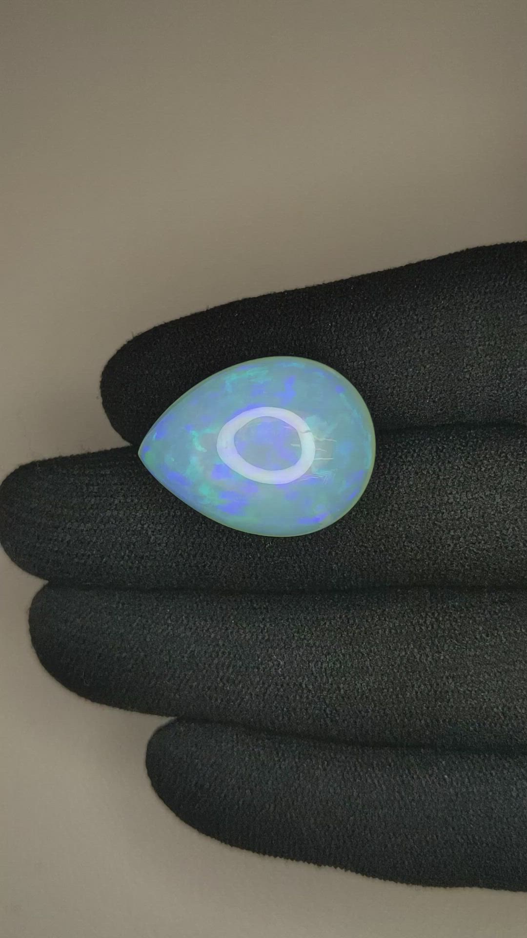 24.73 Ct. Multi Color Cabochon White Opal from Ethiopia Size Video
