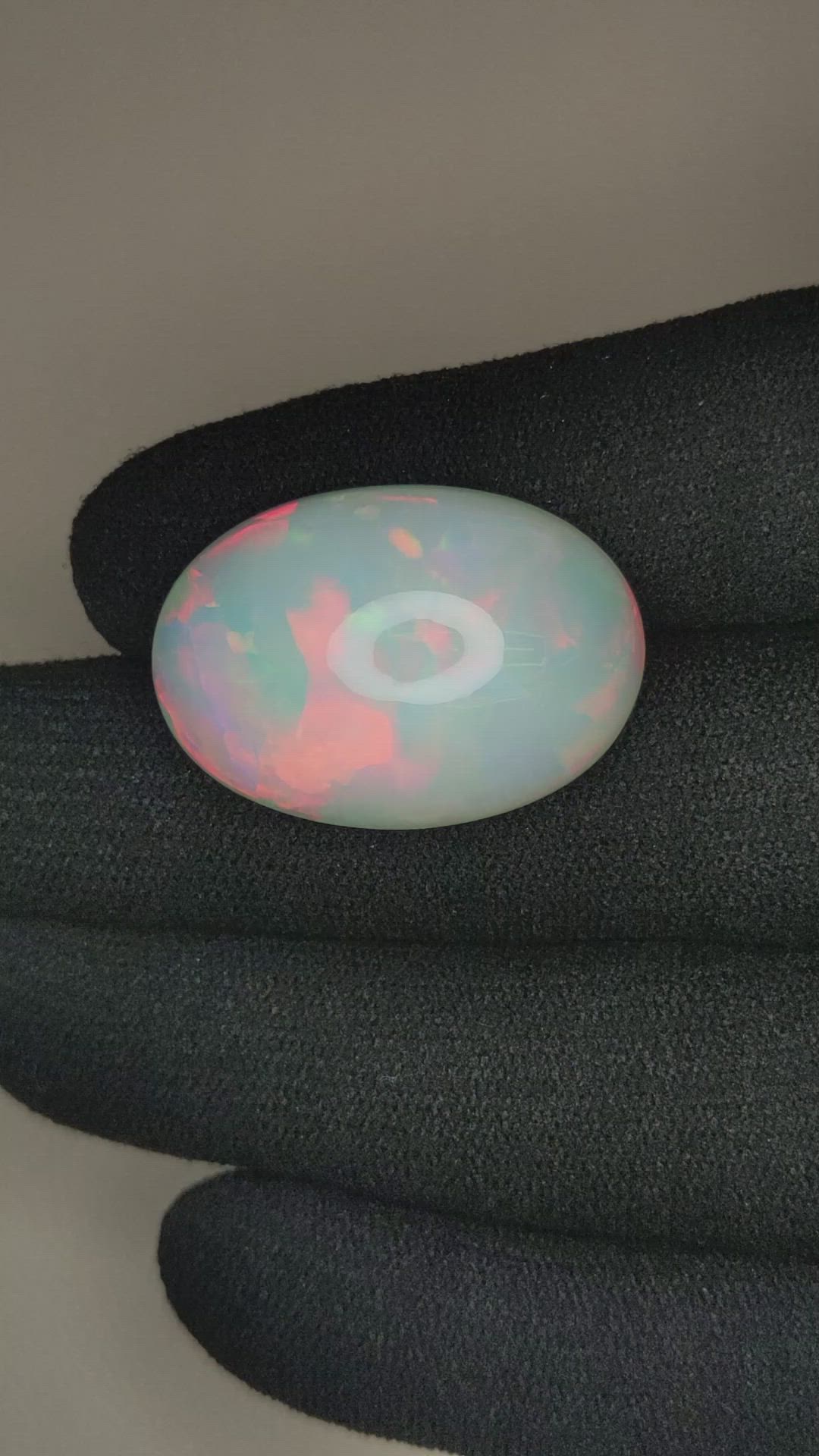 20.97 Ct. Multi Color Cabochon White Opal from Ethiopia Size Video