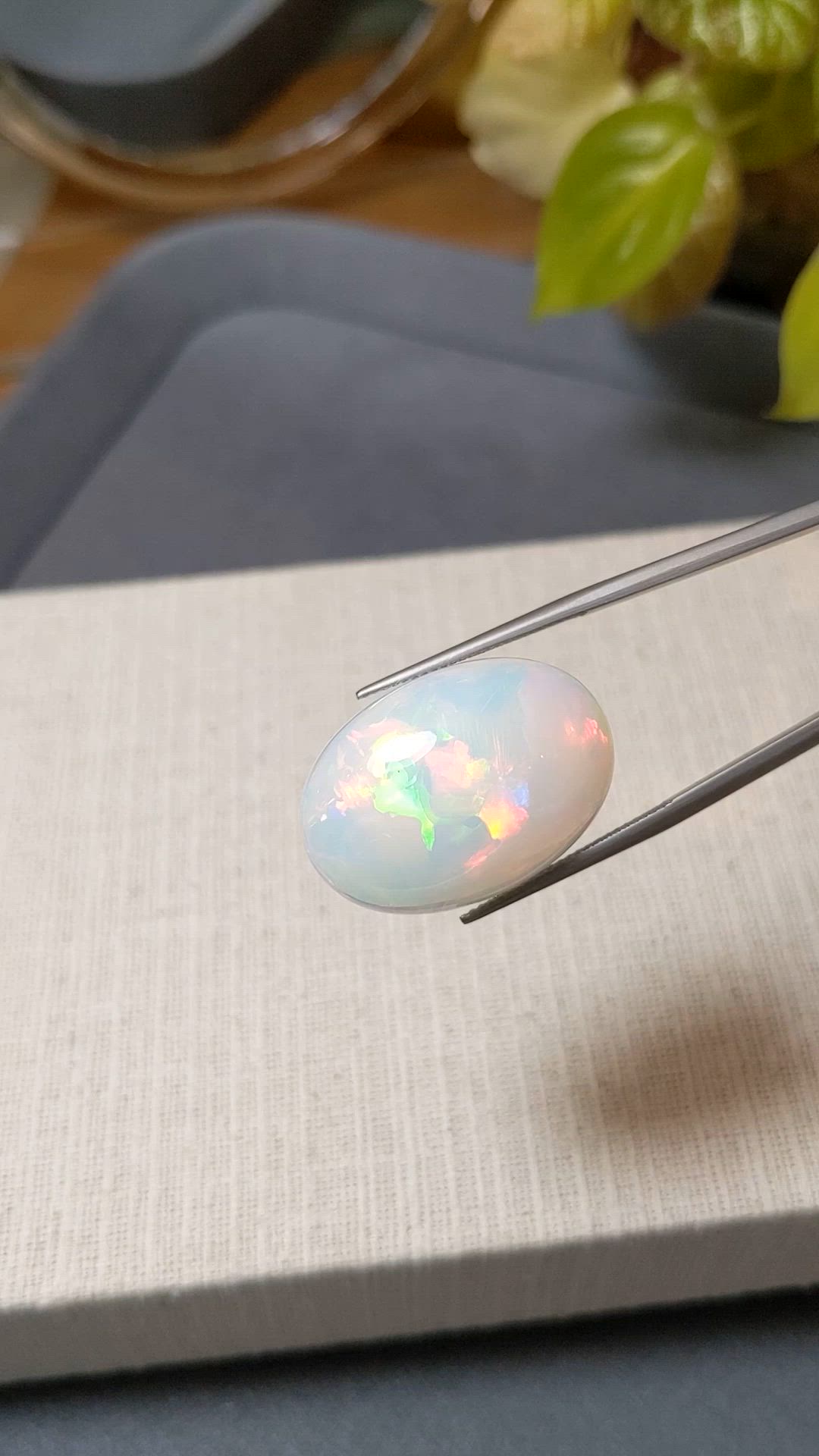 20.97 Ct. Multi Color Cabochon White Opal from Ethiopia Size Video