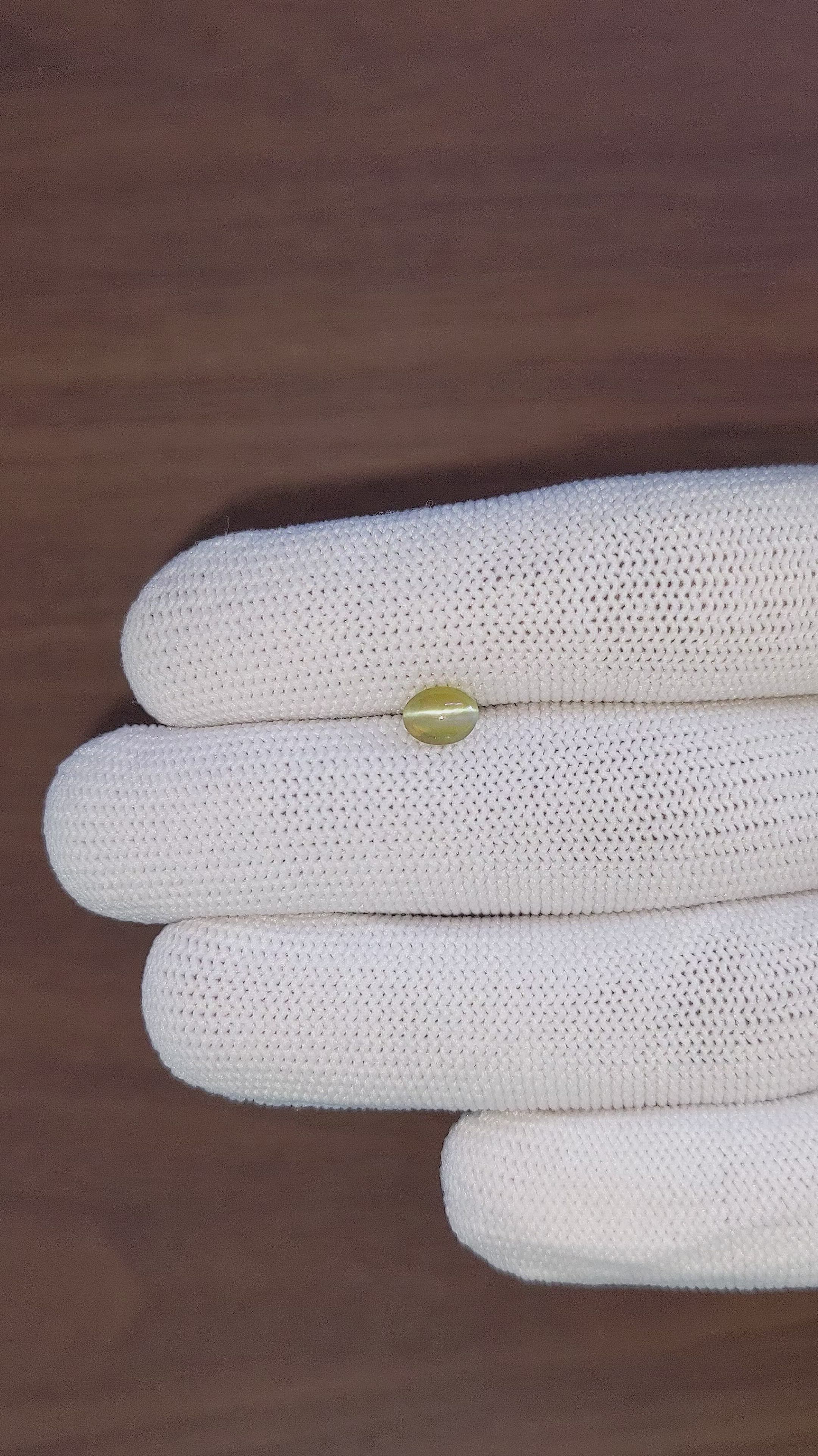 0.93 Ct. Yellowish Green Cabochon Chrysoberyl from Tanzania Size Video