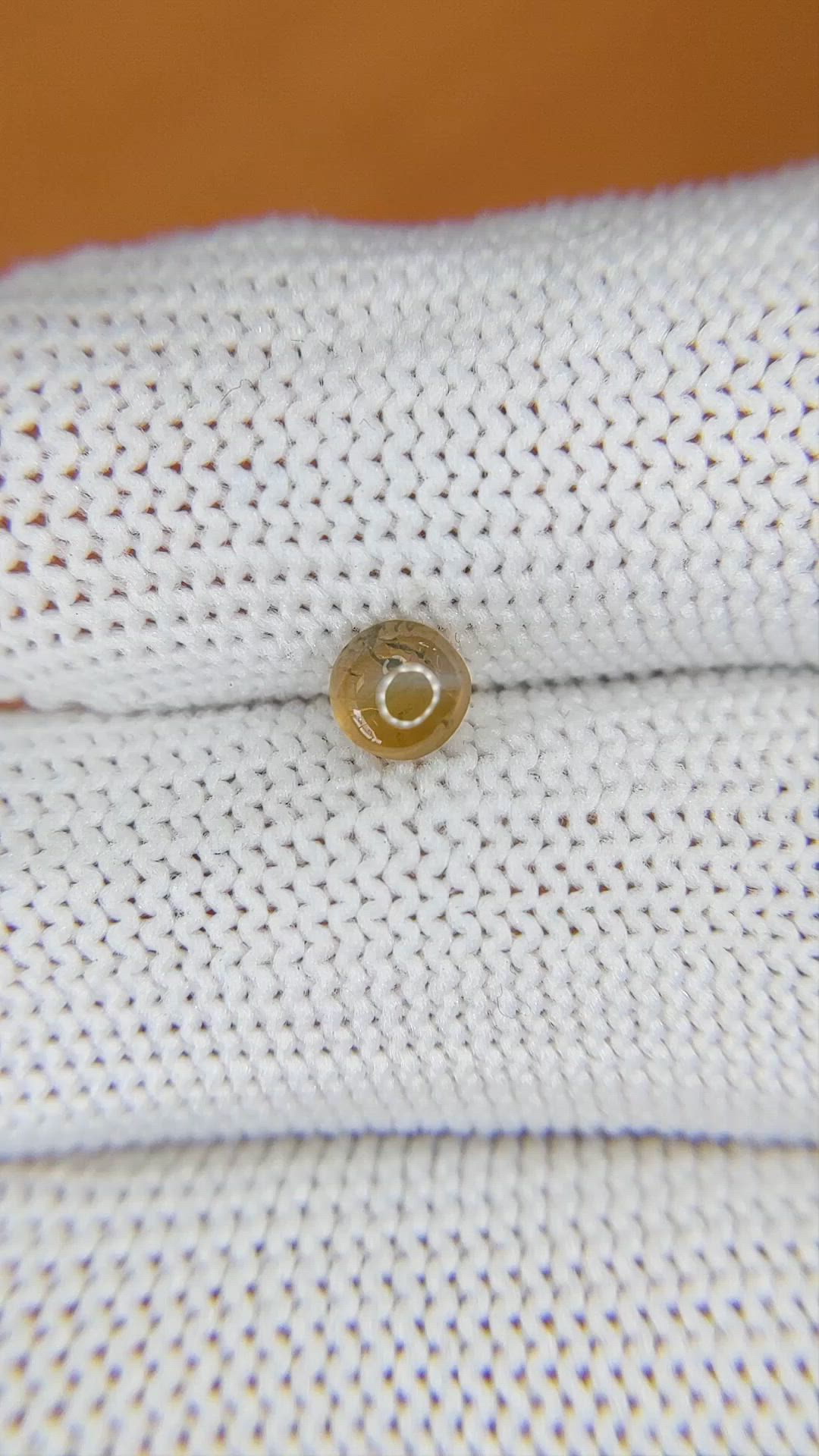 0.79 Ct. Yellowish Brown Cabochon Chrysoberyl from Ceylon (Sri Lanka) Size Video