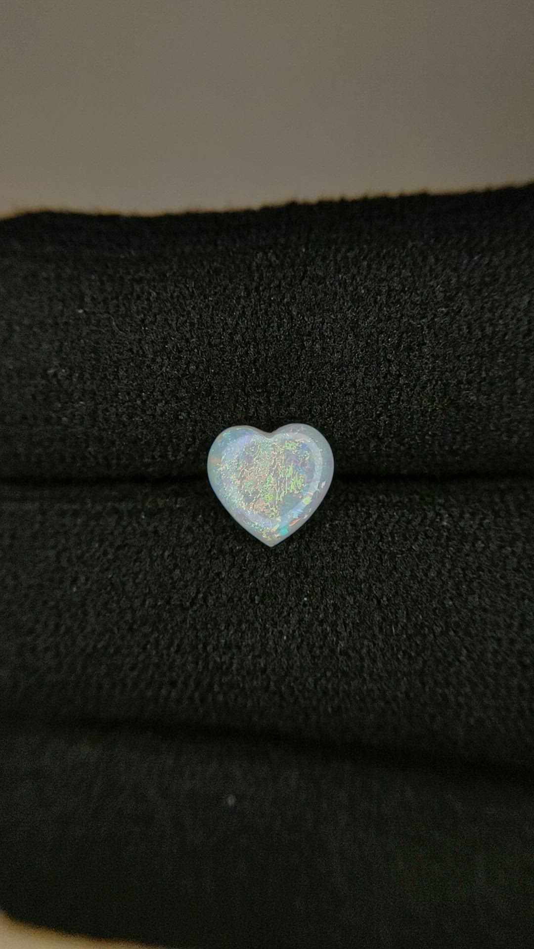 0.52 Ct. Multi Color Cabochon White Opal from Ethiopia Size Video