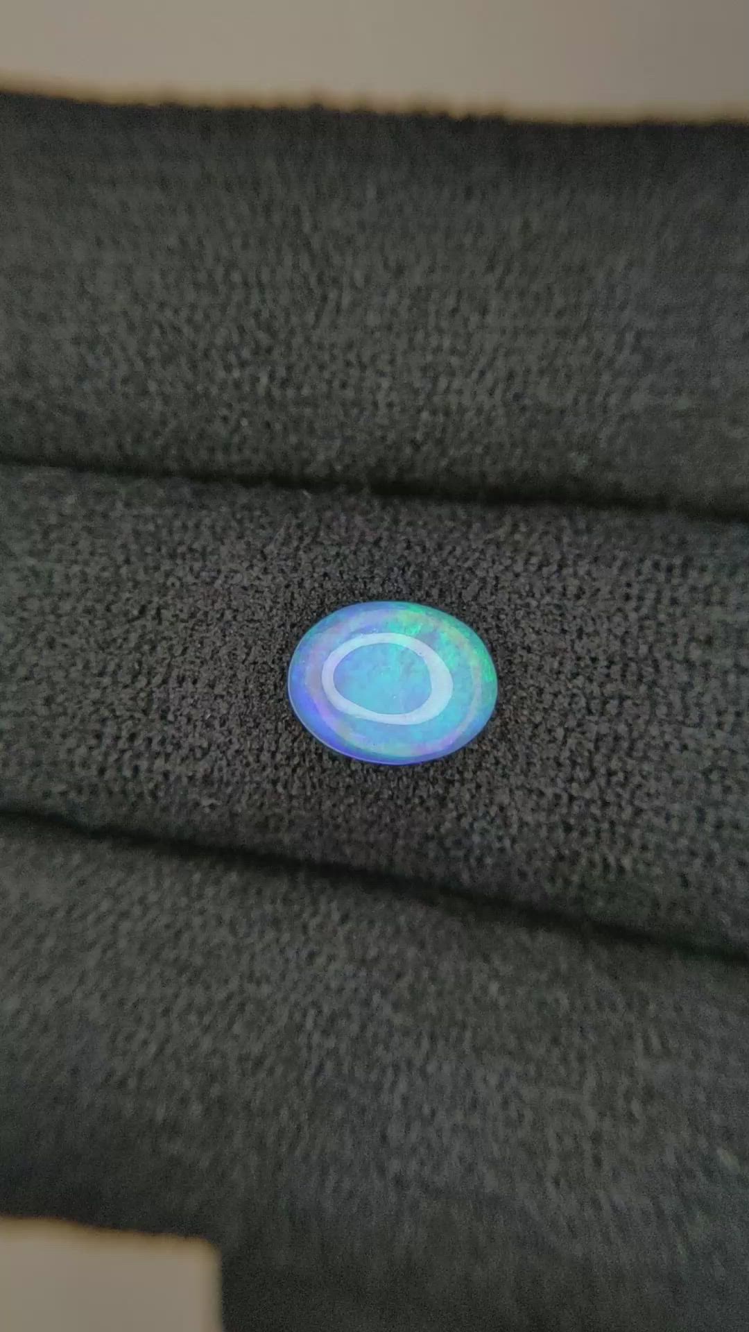 0.77 Ct. Multi Color Cabochon White Opal from Ethiopia Size Video