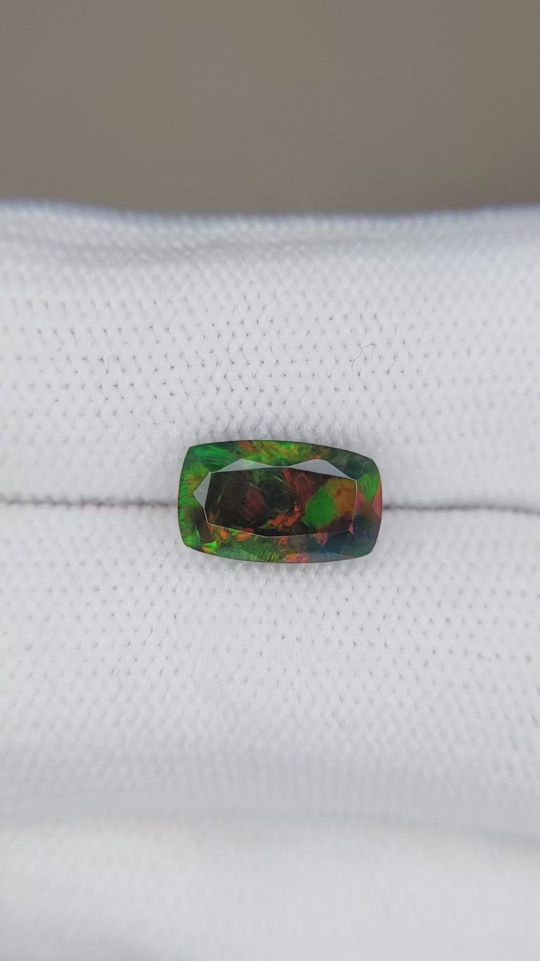 1.36 Ct. Multi Color Black Opal from Ethiopia Size Video