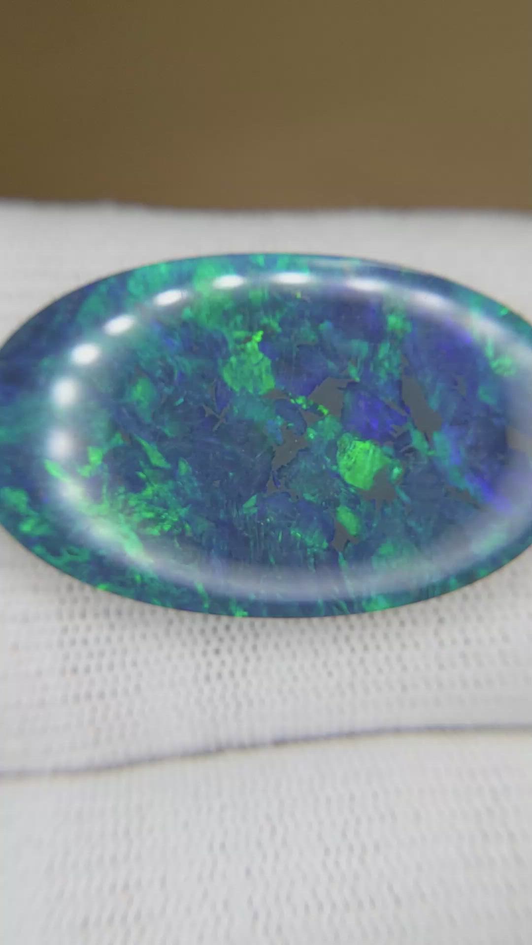 26.57 Ct. Multi Color Cabochon Black Opal from Australia Size Video