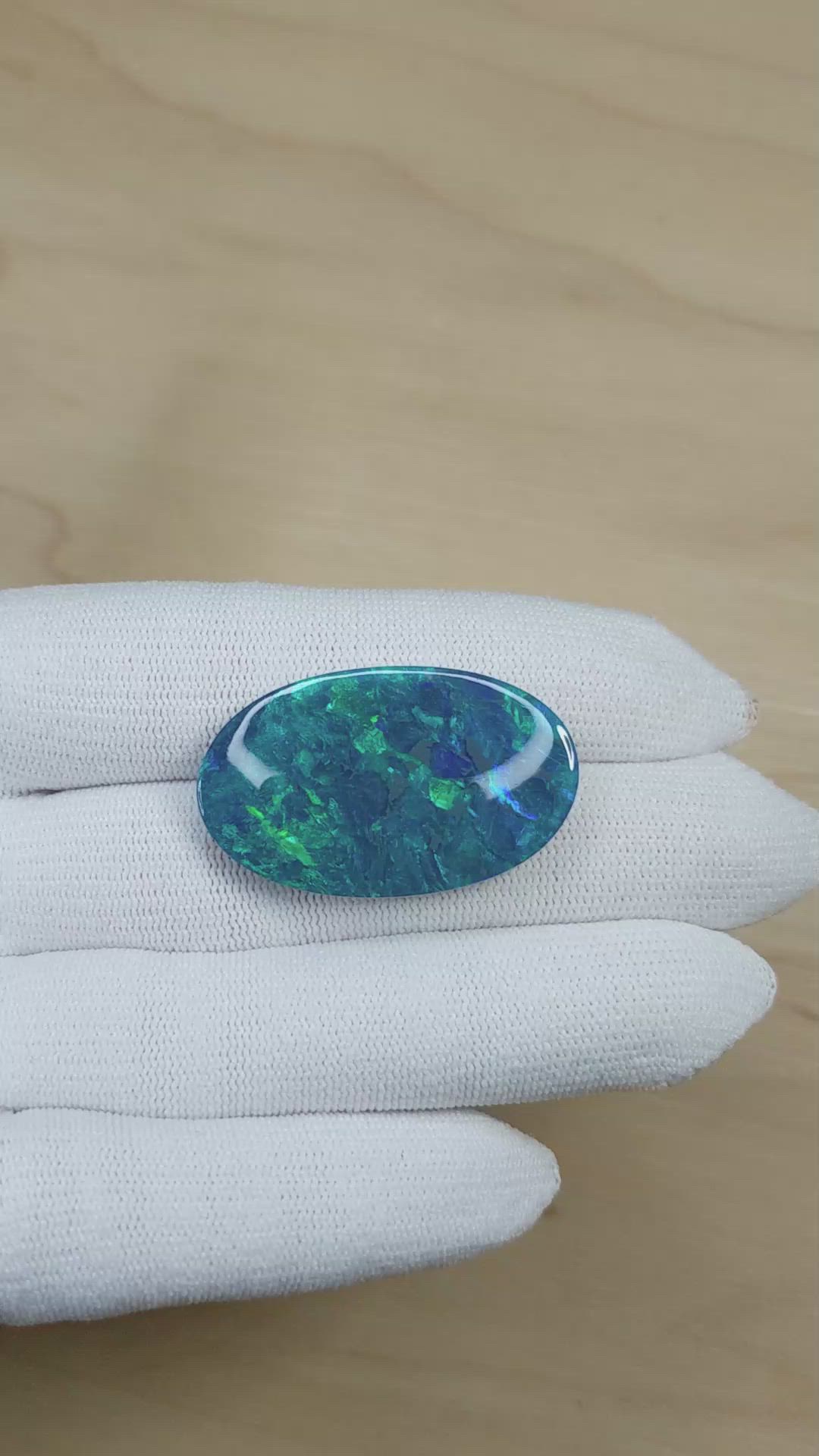 26.57 Ct. Multi Color Cabochon Black Opal from Australia Size Video