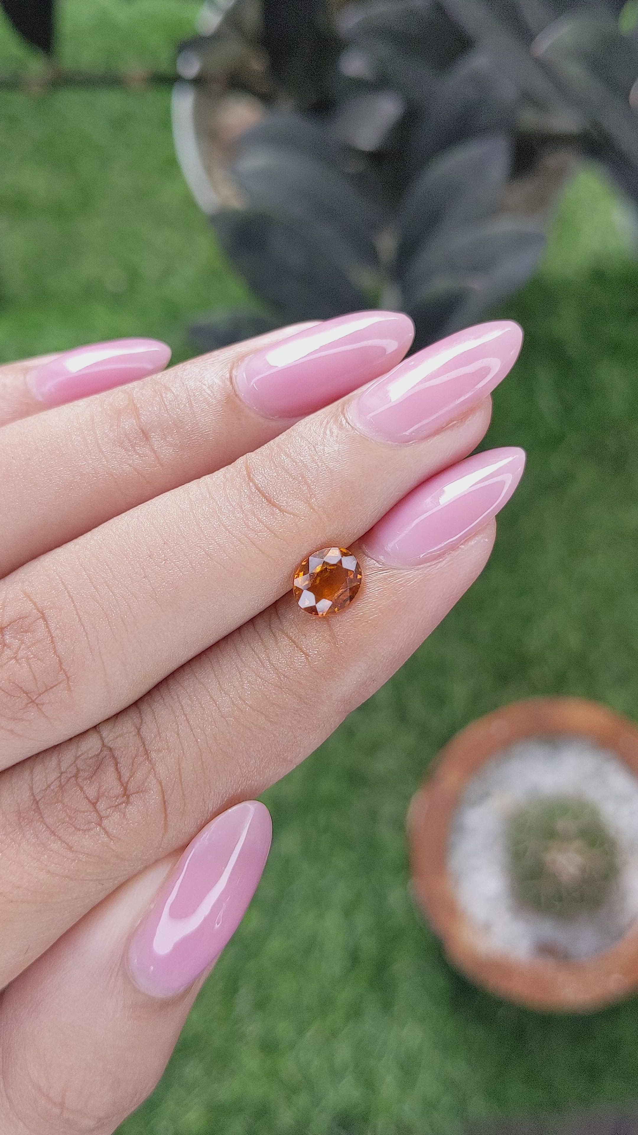 0.94 Ct. Orange Hessonite Garnet Size Video
