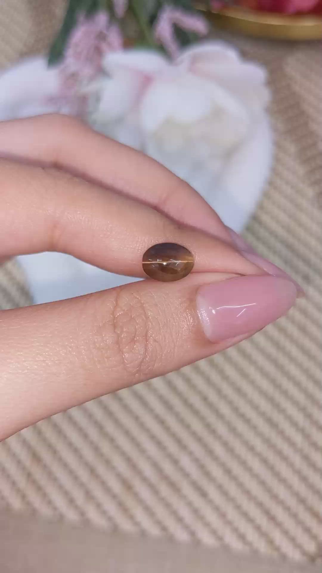 2.32 Ct. Yellowish Brown Cabochon Kornerupine from Ceylon (Sri Lanka) Size Video