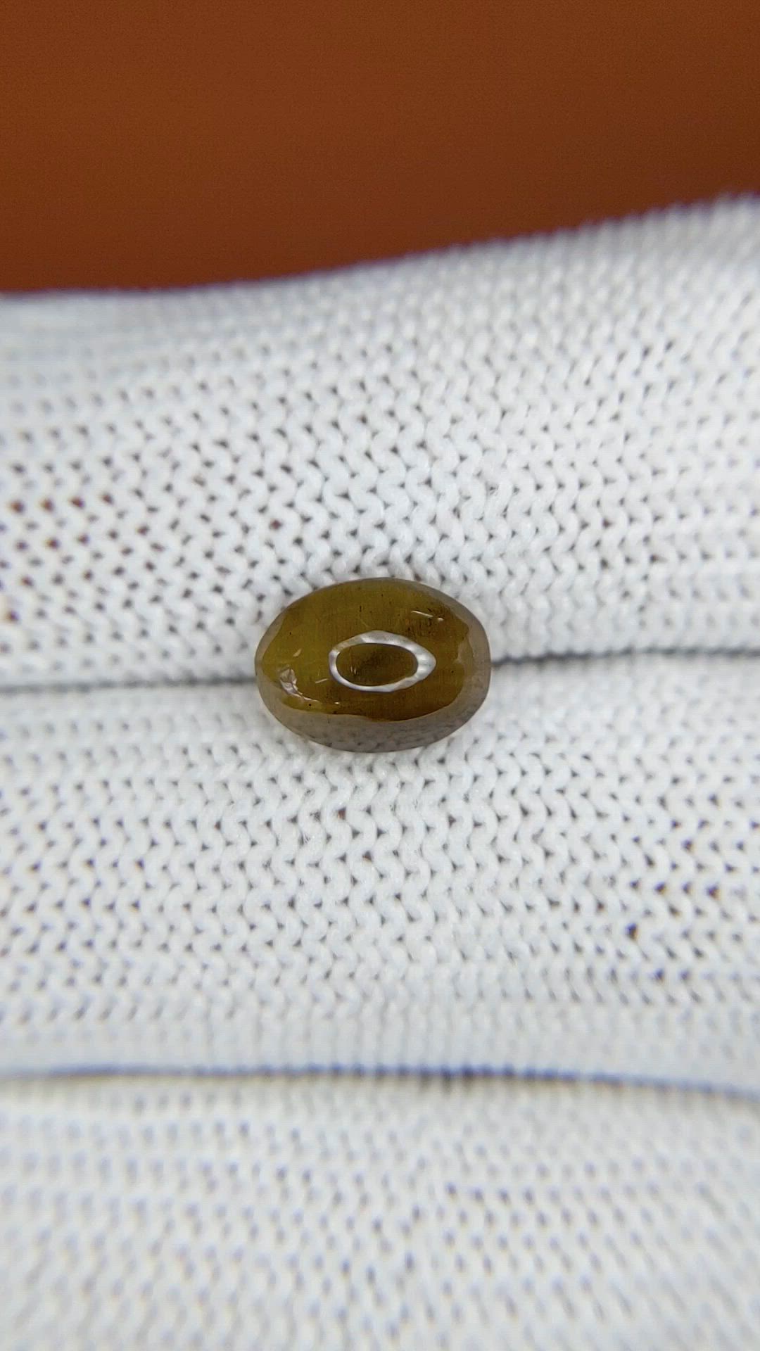 2.32 Ct. Yellowish Brown Cabochon Kornerupine from Ceylon (Sri Lanka) Size Video