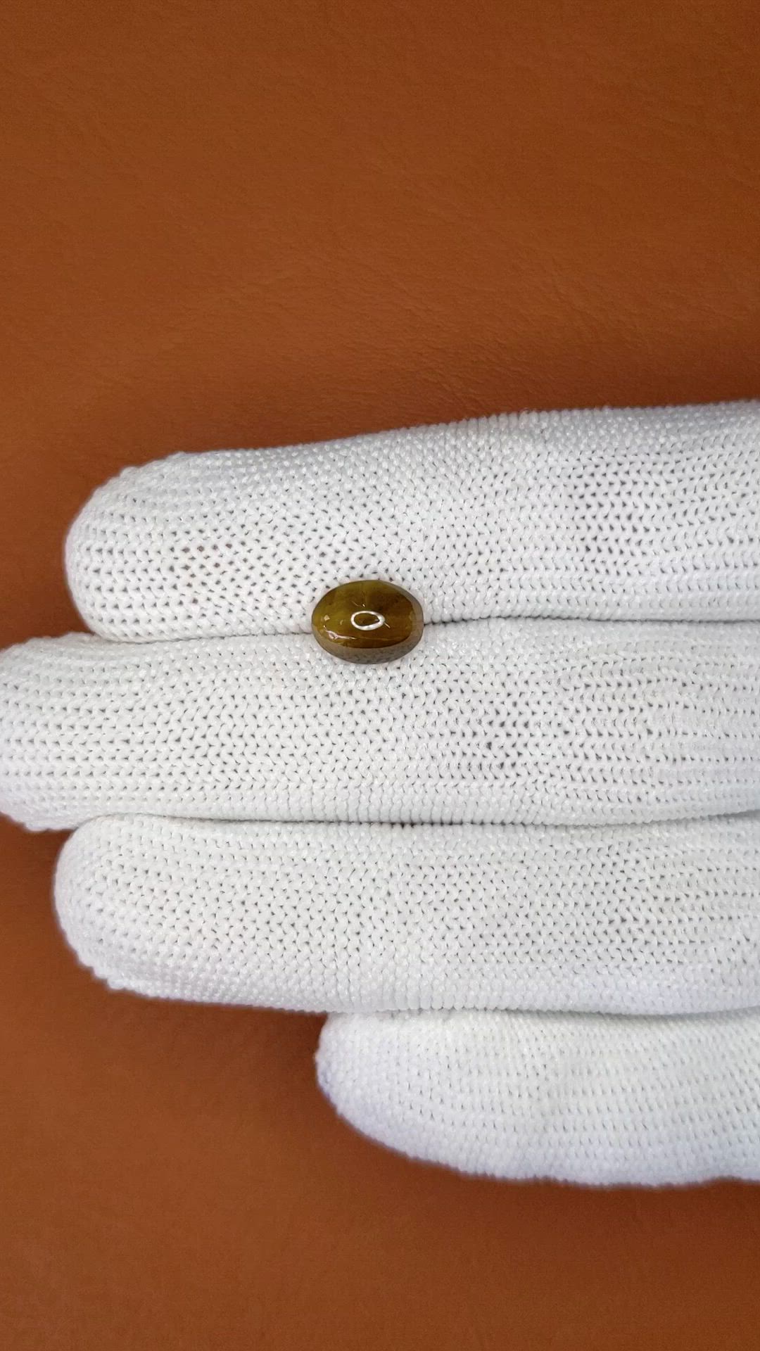 2.32 Ct. Yellowish Brown Cabochon Kornerupine from Ceylon (Sri Lanka) Size Video