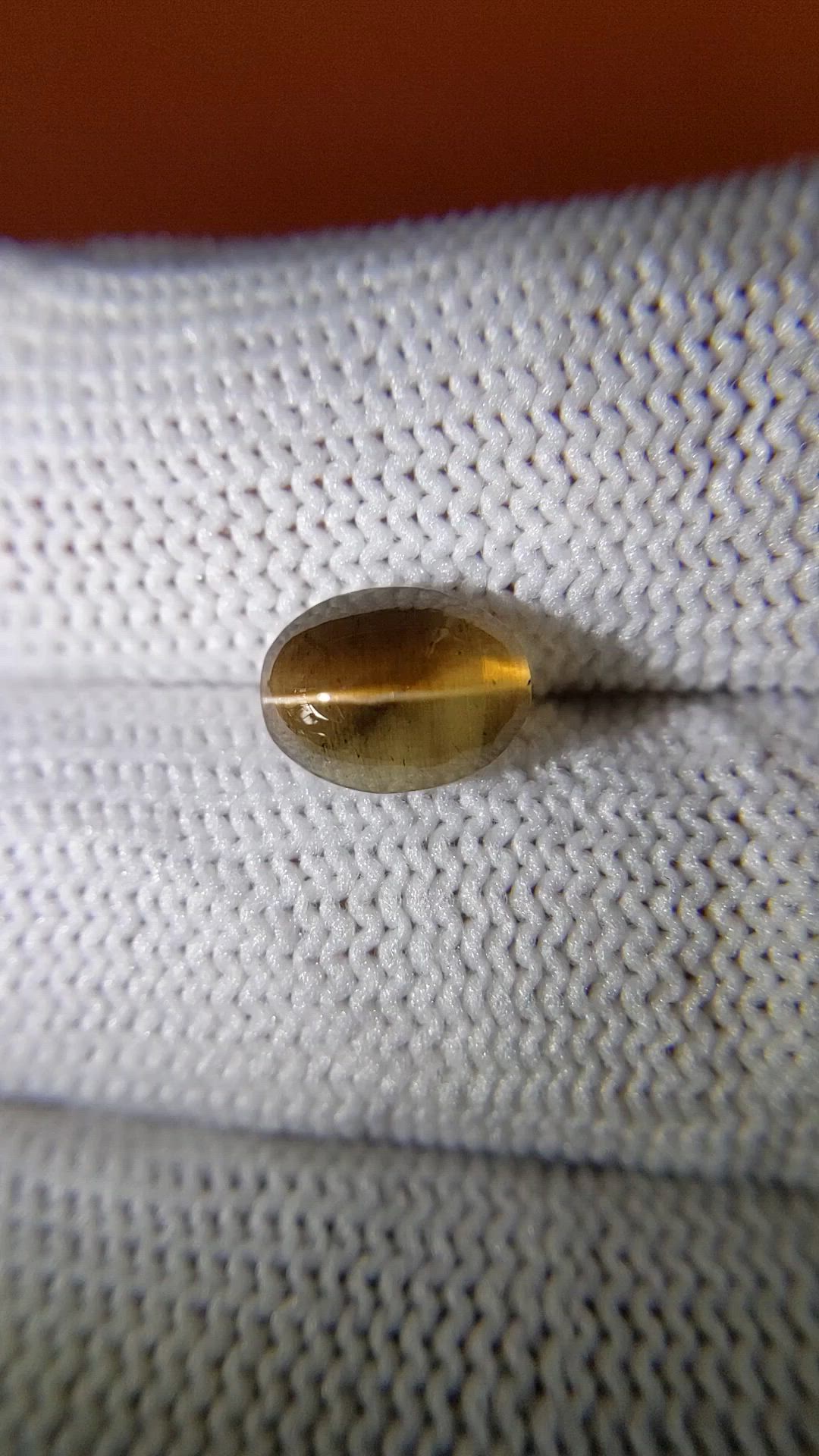 2.32 Ct. Yellowish Brown Cabochon Kornerupine from Ceylon (Sri Lanka) Size Video