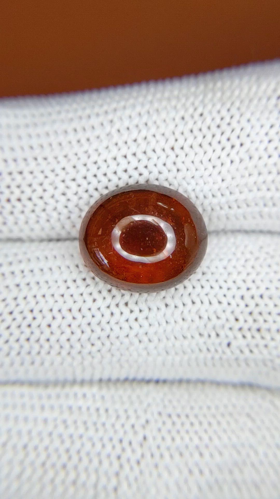 8.82 Ct. Reddish Orange Cabochon Hessonite Garnet from Madagascar Size Video