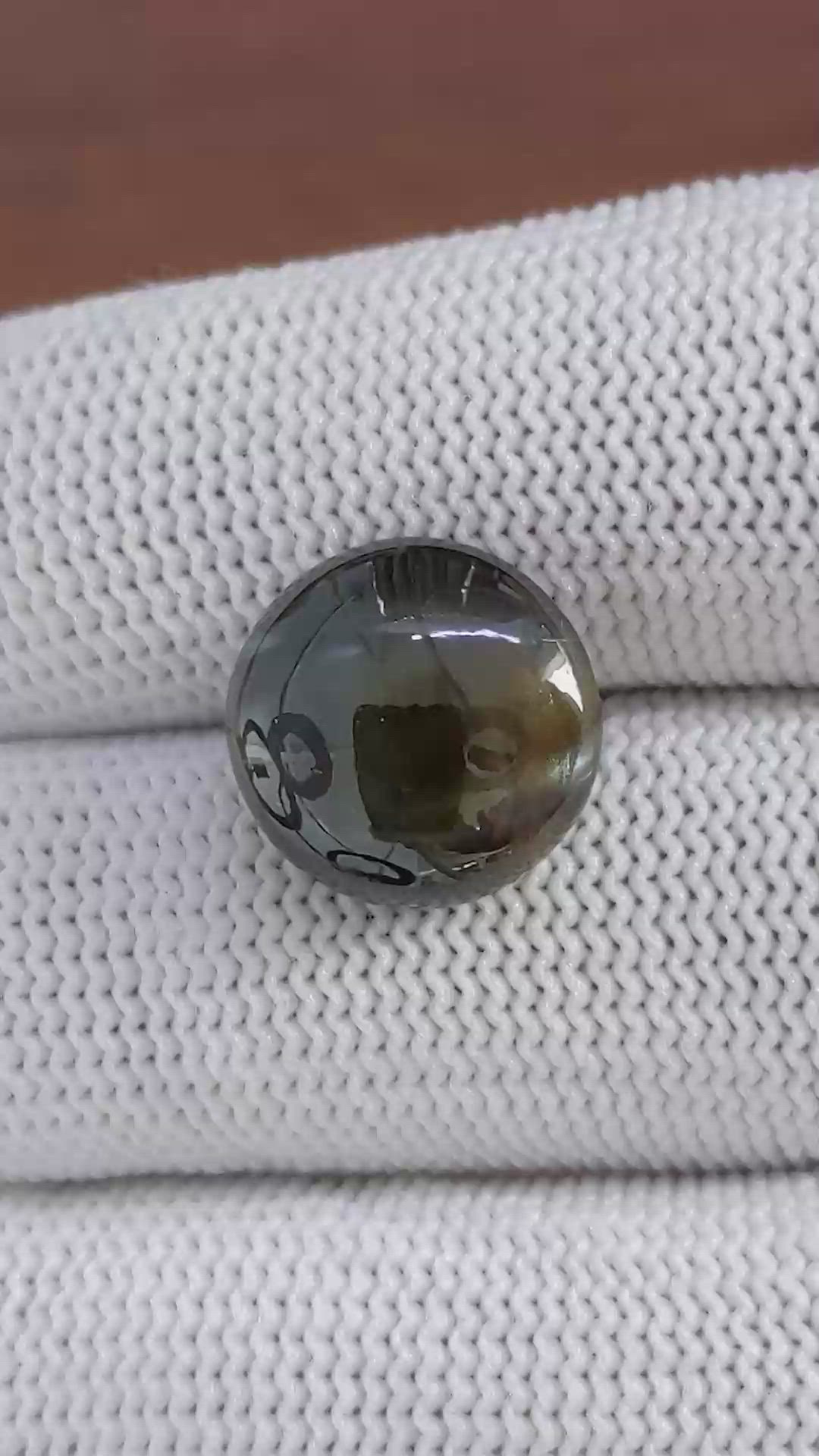 11.54 Ct. Brownish Green Cabochon Chrysoberyl from Ceylon (Sri Lanka) Size Video