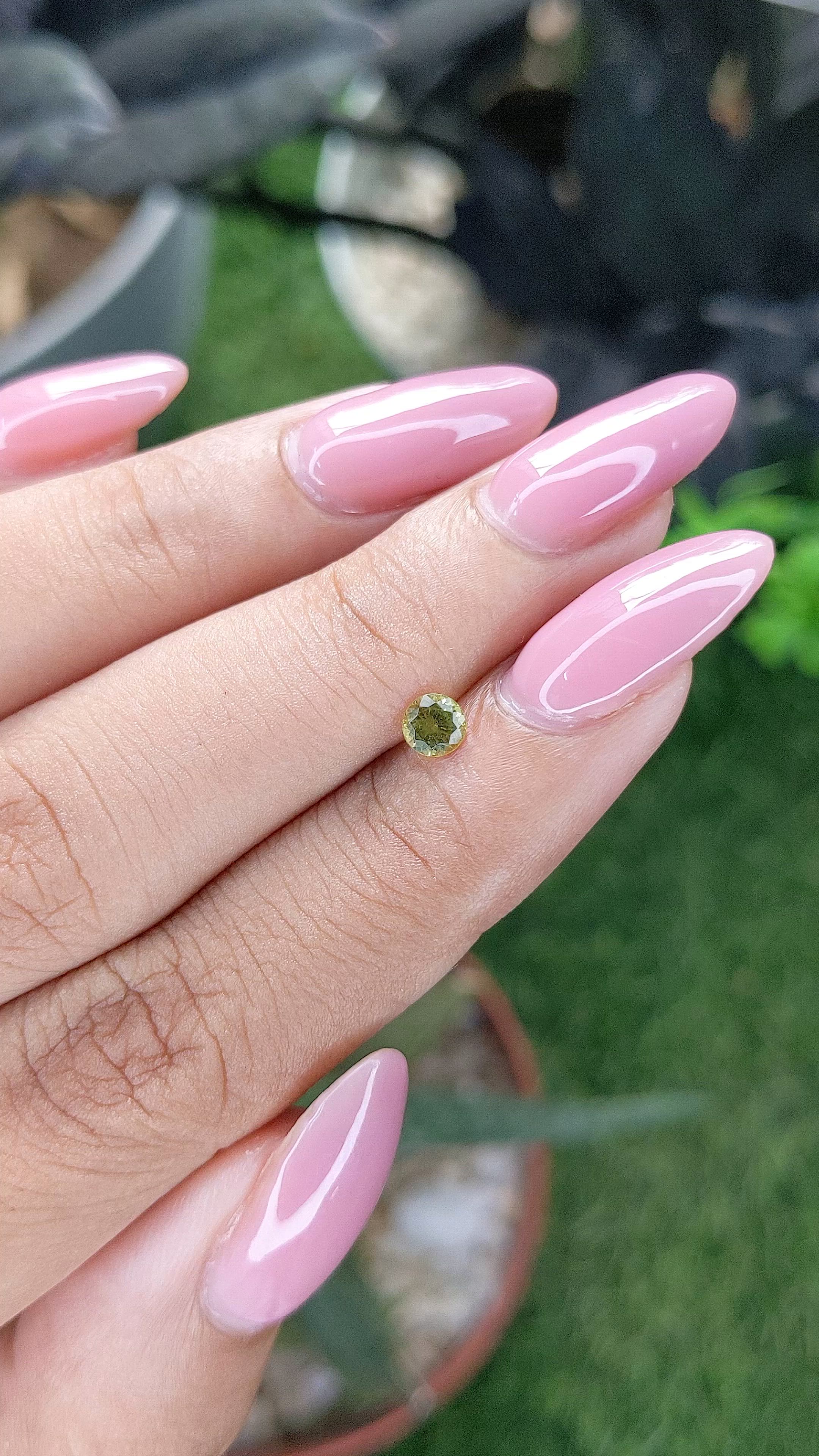0.25 Ct. Yellowish Green Peridot from Tanzania Size Video